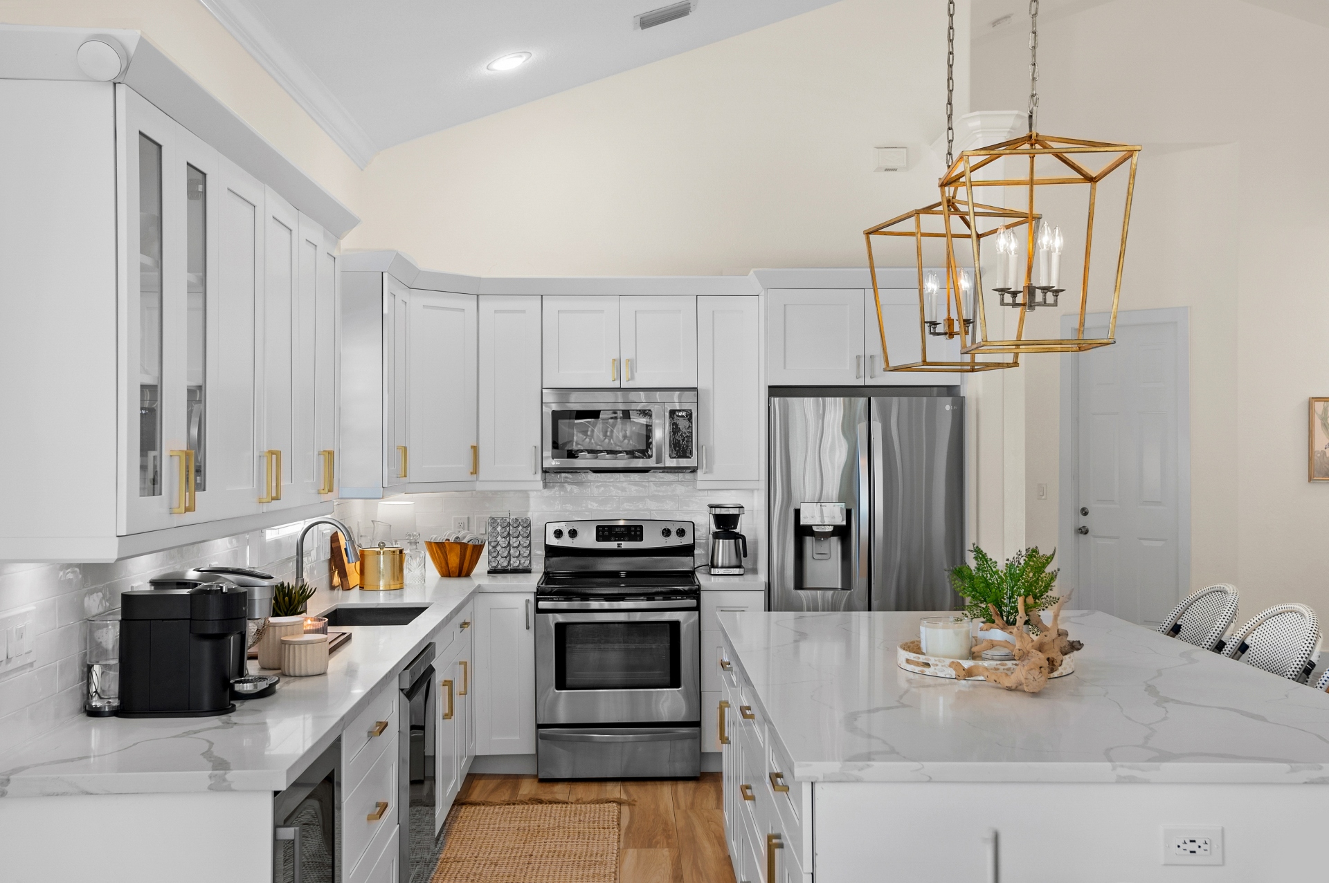 Fully Stocked Kitchen w/ Bar Seating and Two Tables!