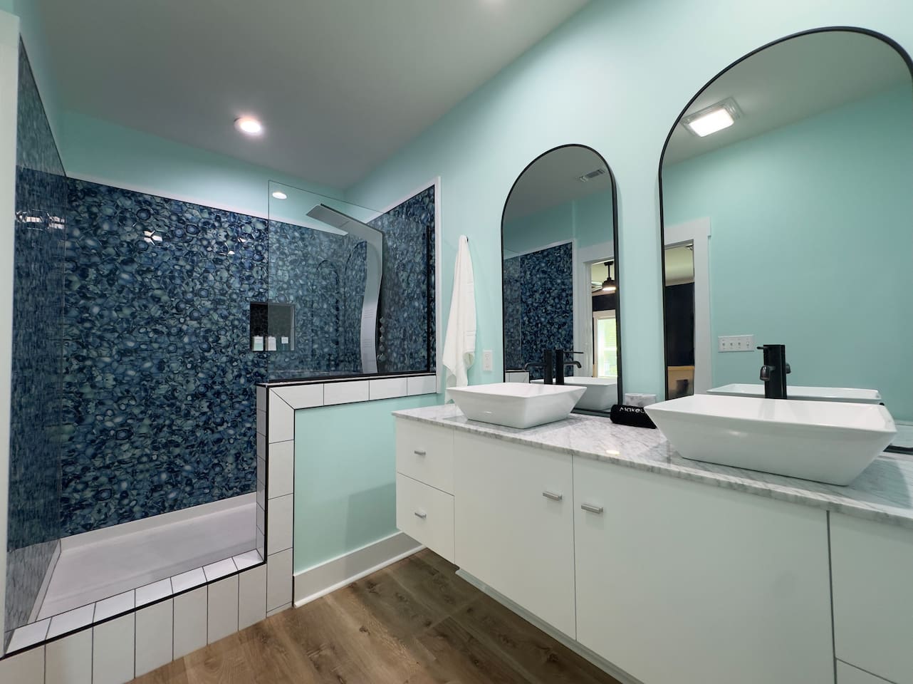 Refresh in this airy space with dual sinks and sleek touches.