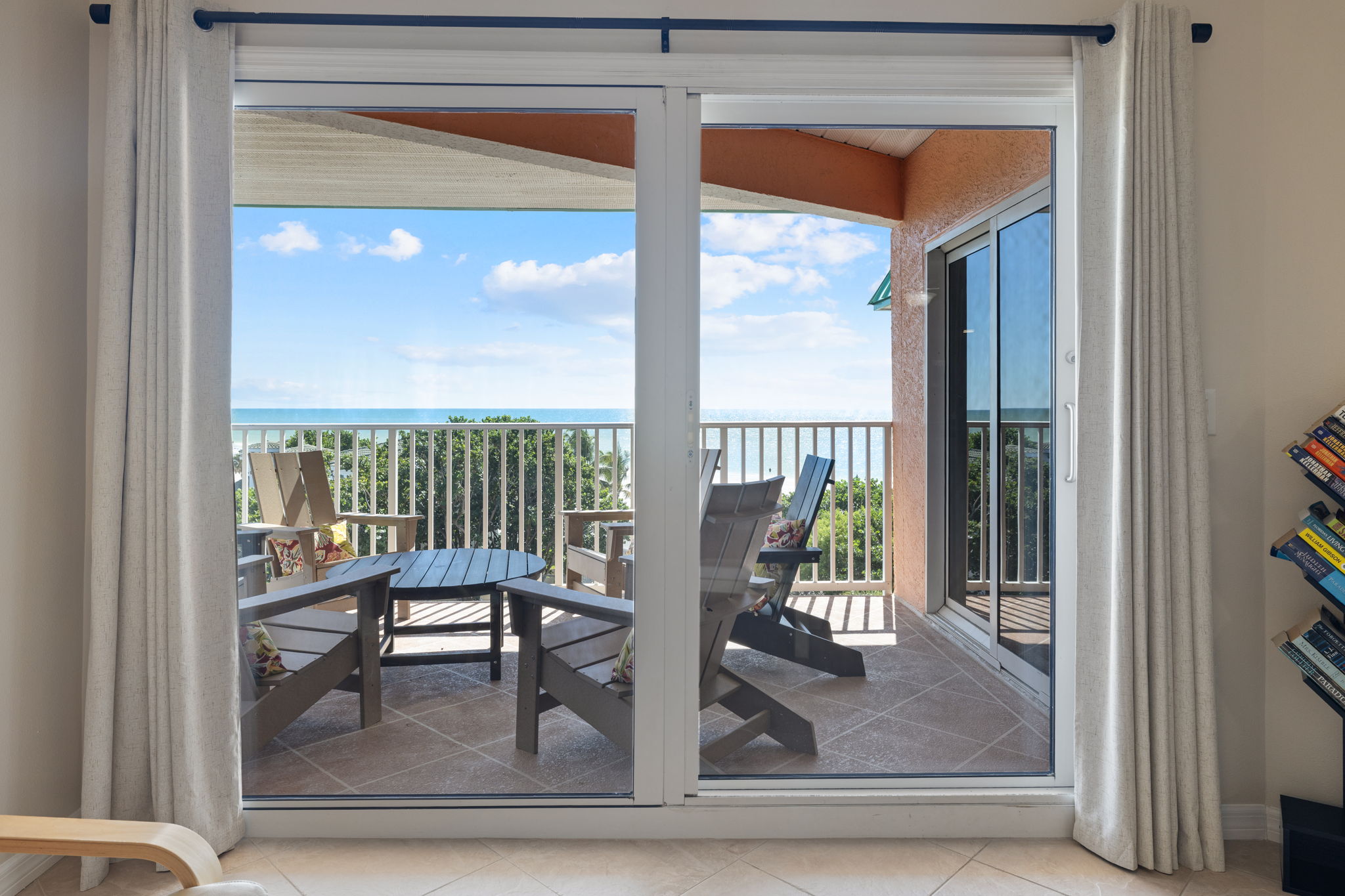 King size master bedroom with gulf views and patio access.