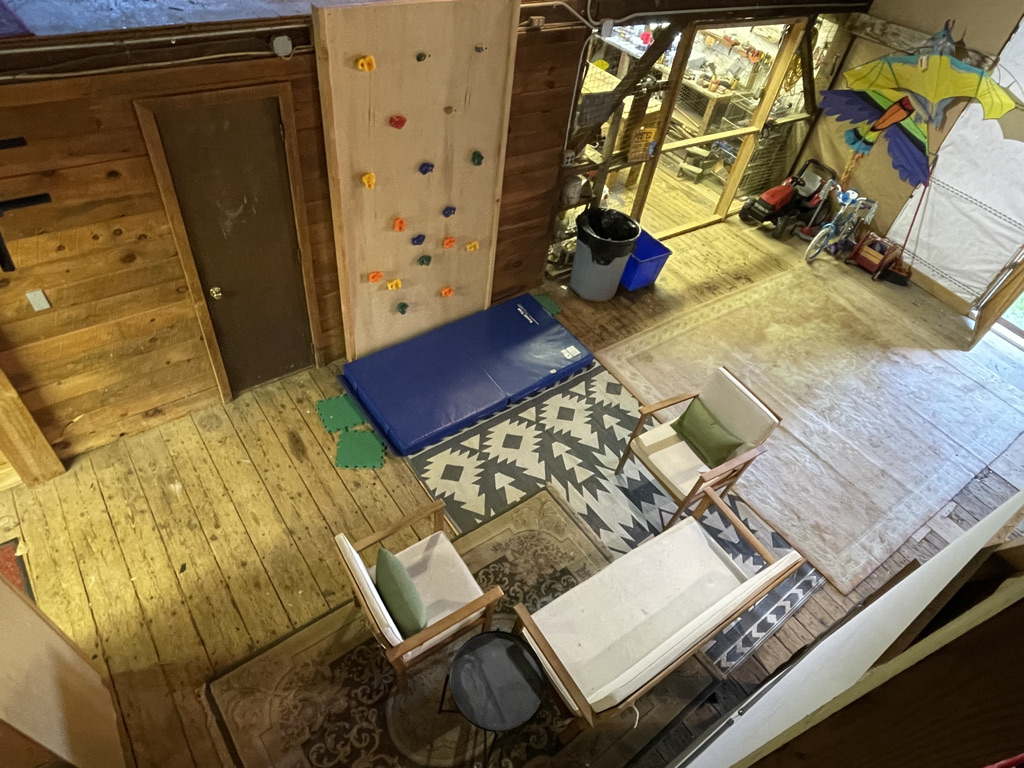 Shared space in barn w sitting area and activities for kids