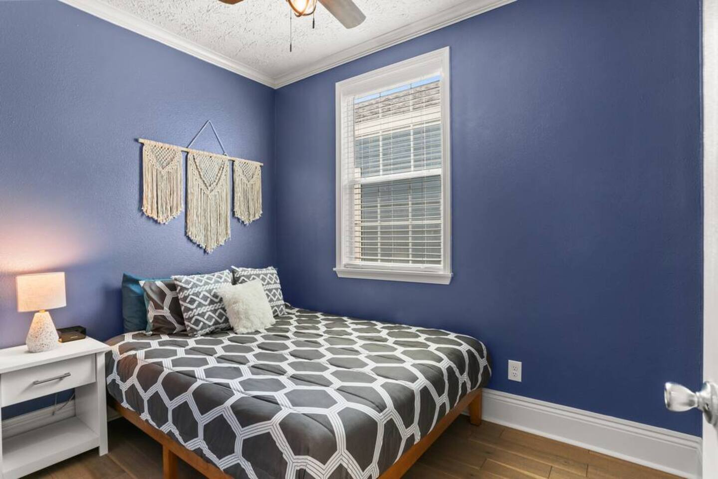 The Blue Room has a queen bed, closet, and ceiling fan for cool, comfy, restful nights.