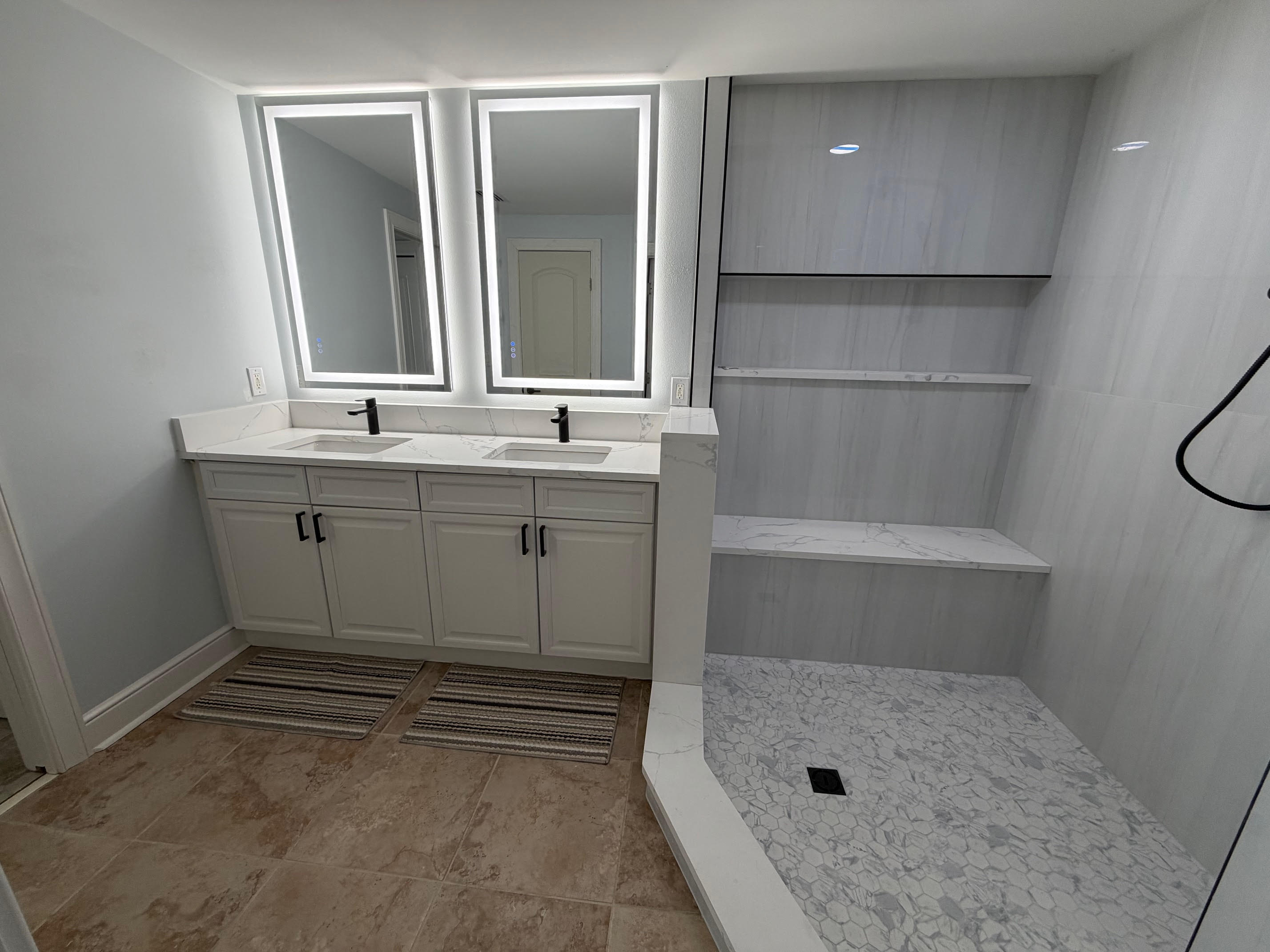 Start your day with plenty of space—double sinks, bright lighting, and a large walk-in tiled shower make mornings easy for everyone.