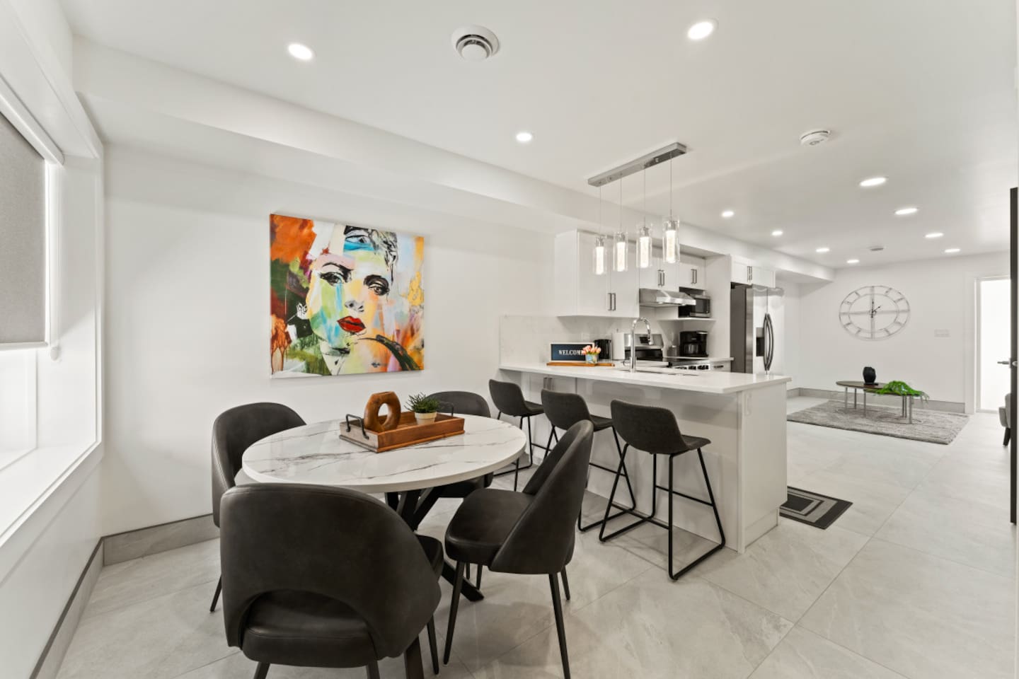 Black modern chairs add contrast and sophistication.