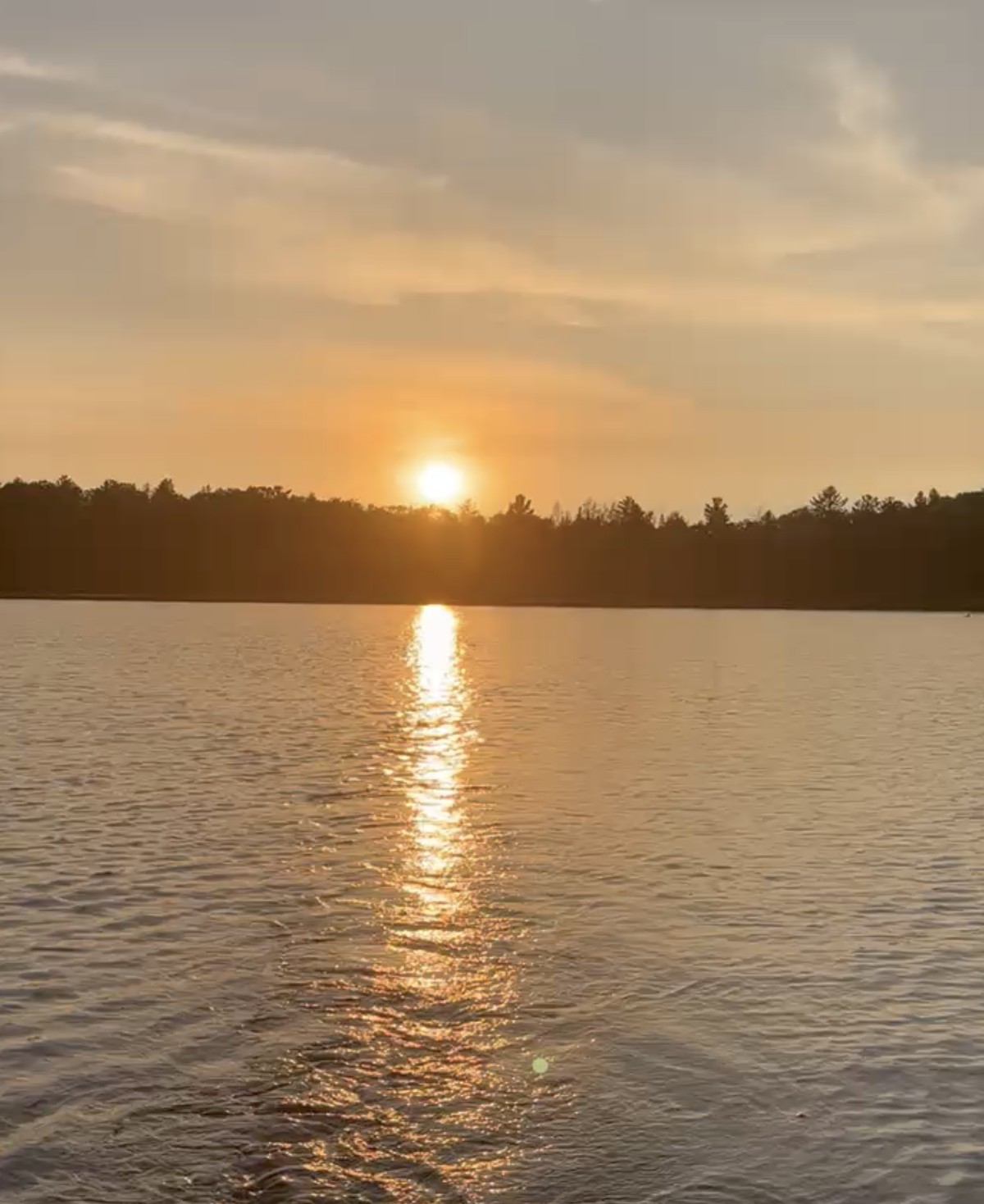 In the fishing boat with trolling motor on Little Sand Lake at sunset.  