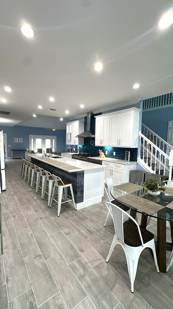 Chef Kitchen with huge island, range, two fridges, drinks fridge, and more. 