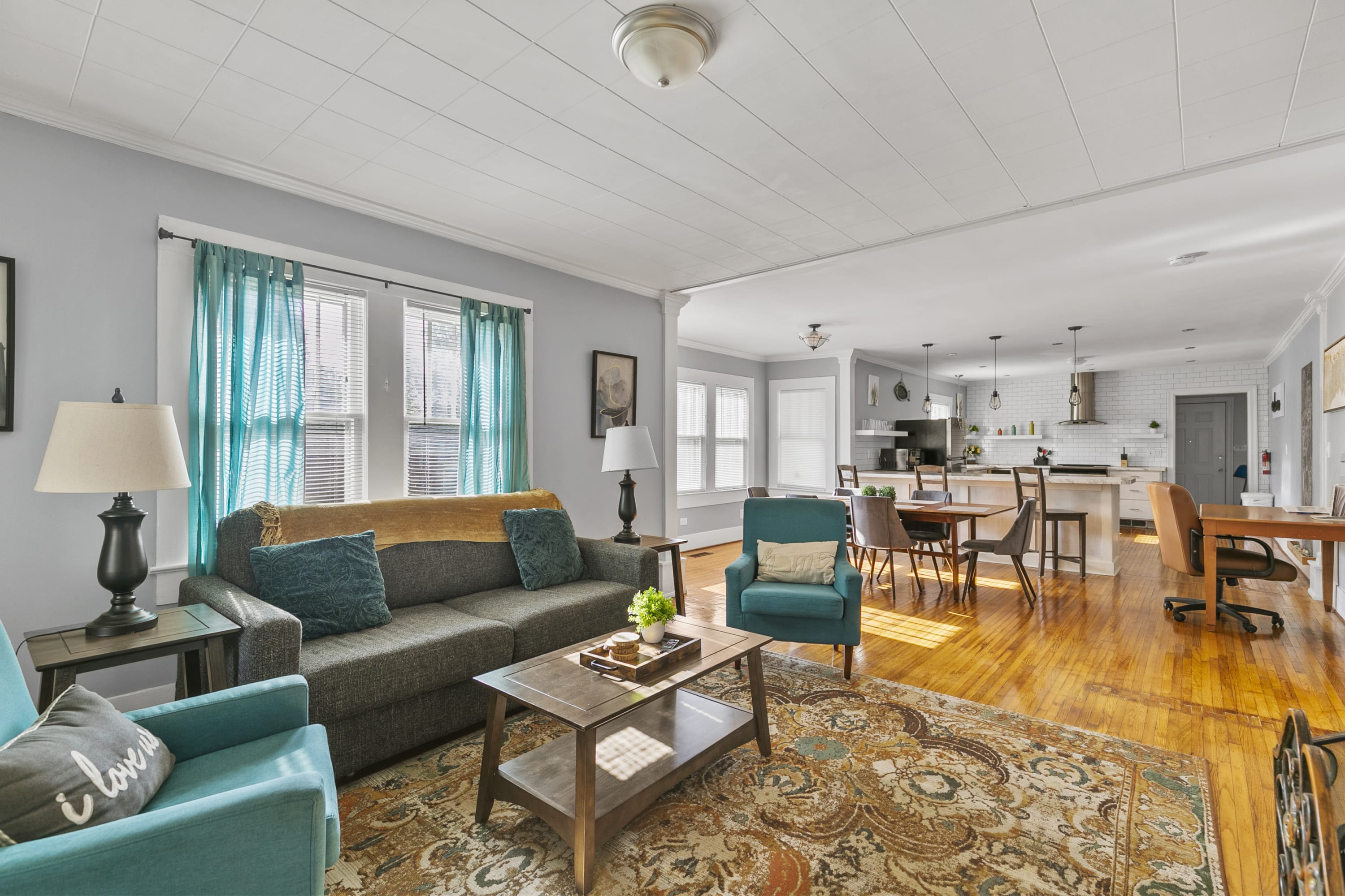 The main living area connects seamlessly to the front entry and the dining and kitchen areas, making coming and going feel easy and natural.