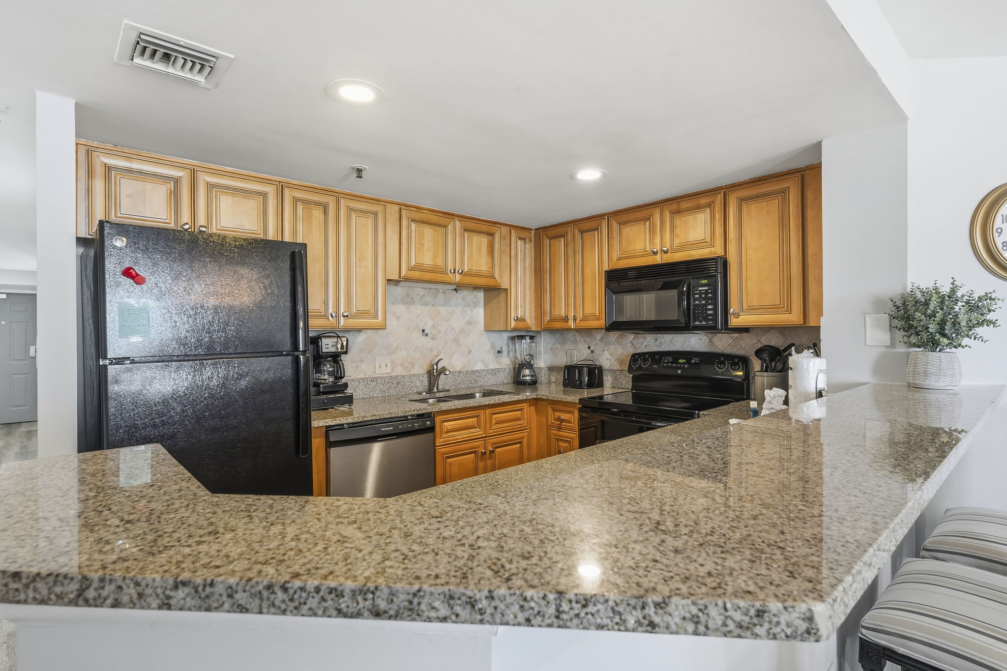 Kitchen with dishwasher and breakfast bar