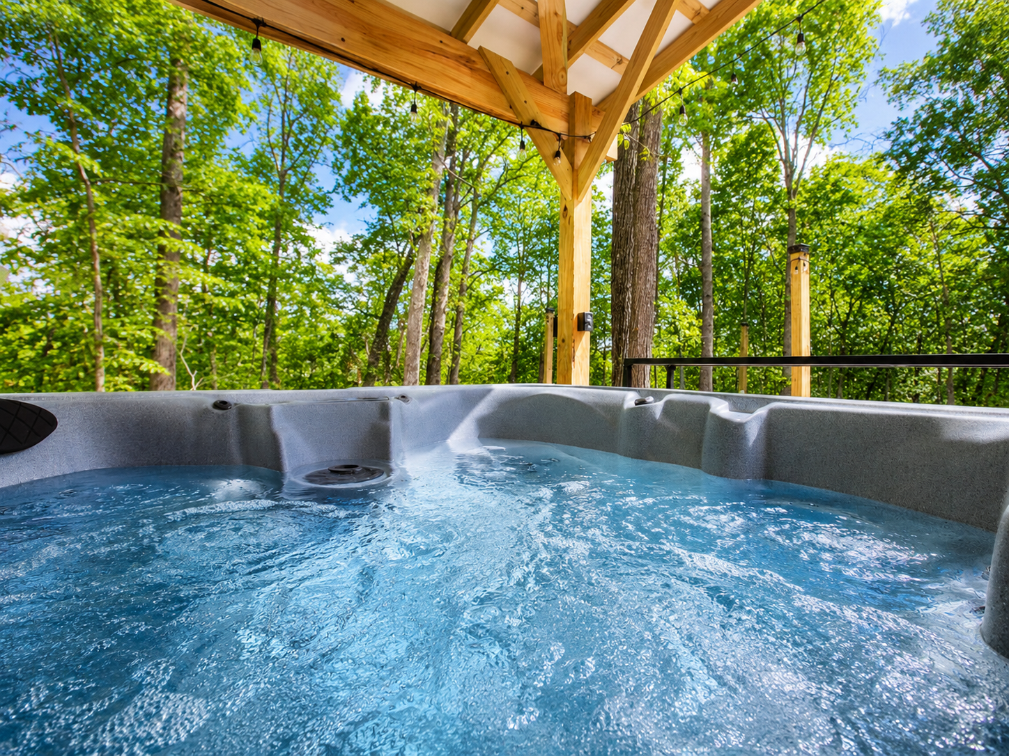 Private hot tub surrounded by trees — the perfect place to relax and unwind after a quiet day in nature