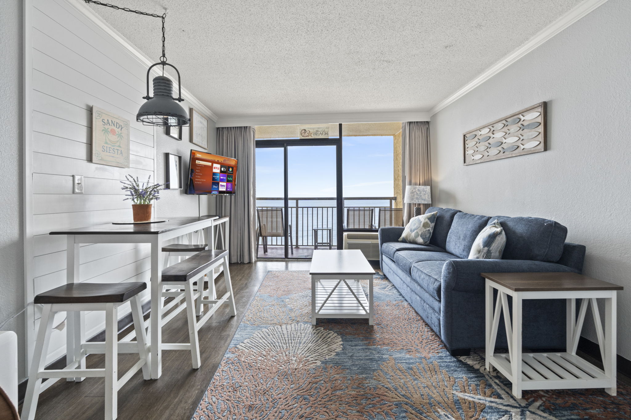 Enjoy ocean views from the living room, Smart TV enabled