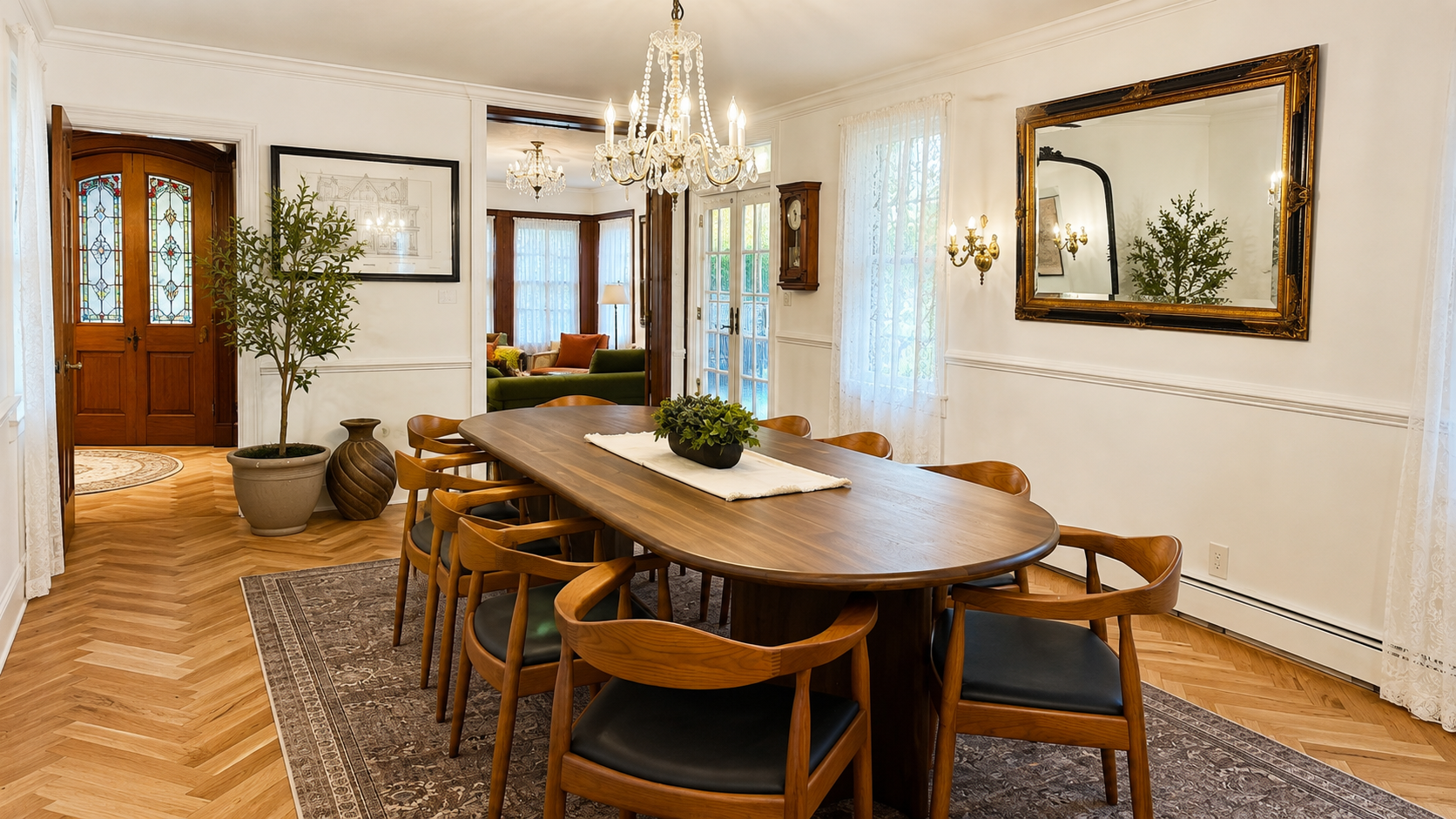 Elegant dining room with seating for 10 beneath the original crystal chandelier.
