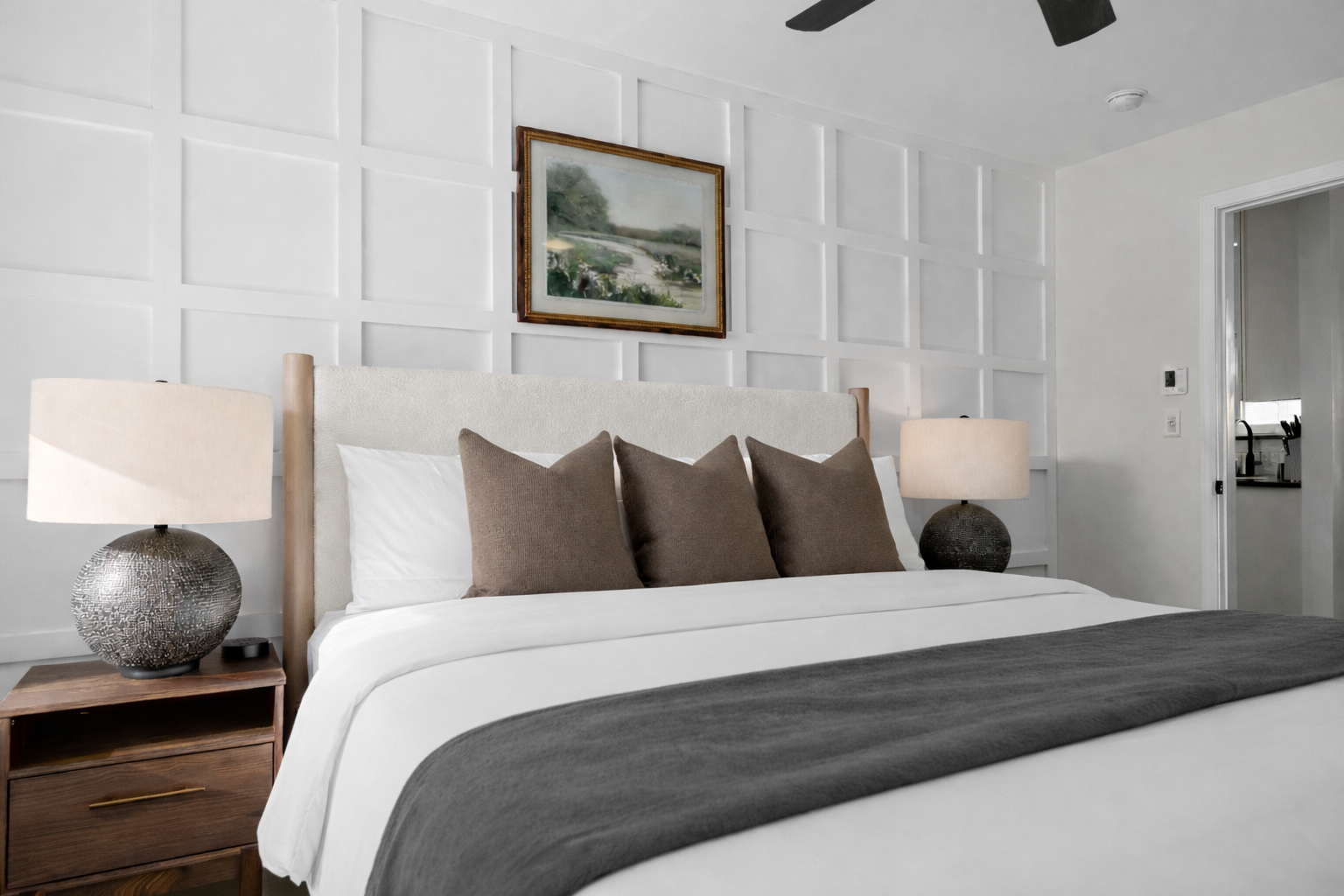 Elegant bedroom with plush king bed, soft lighting, and a stylish accent wall—offering a peaceful, hotel-like retreat for a great night’s sleep.