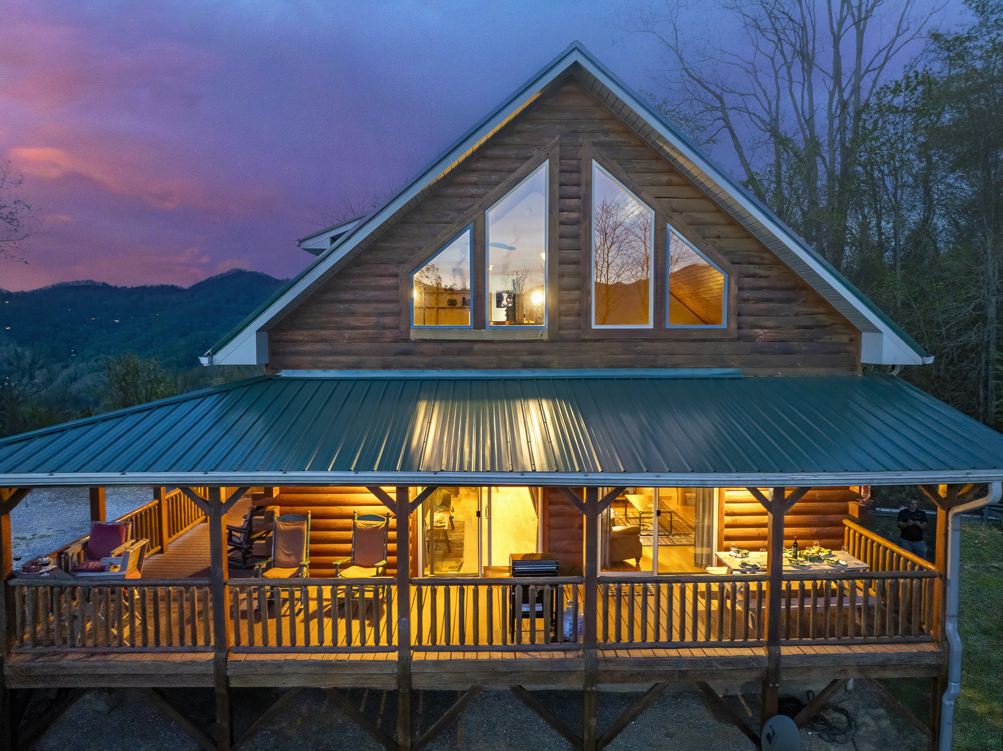 Exterior Escape: Embrace breathtaking mountain views from this charming log cabin porch!

