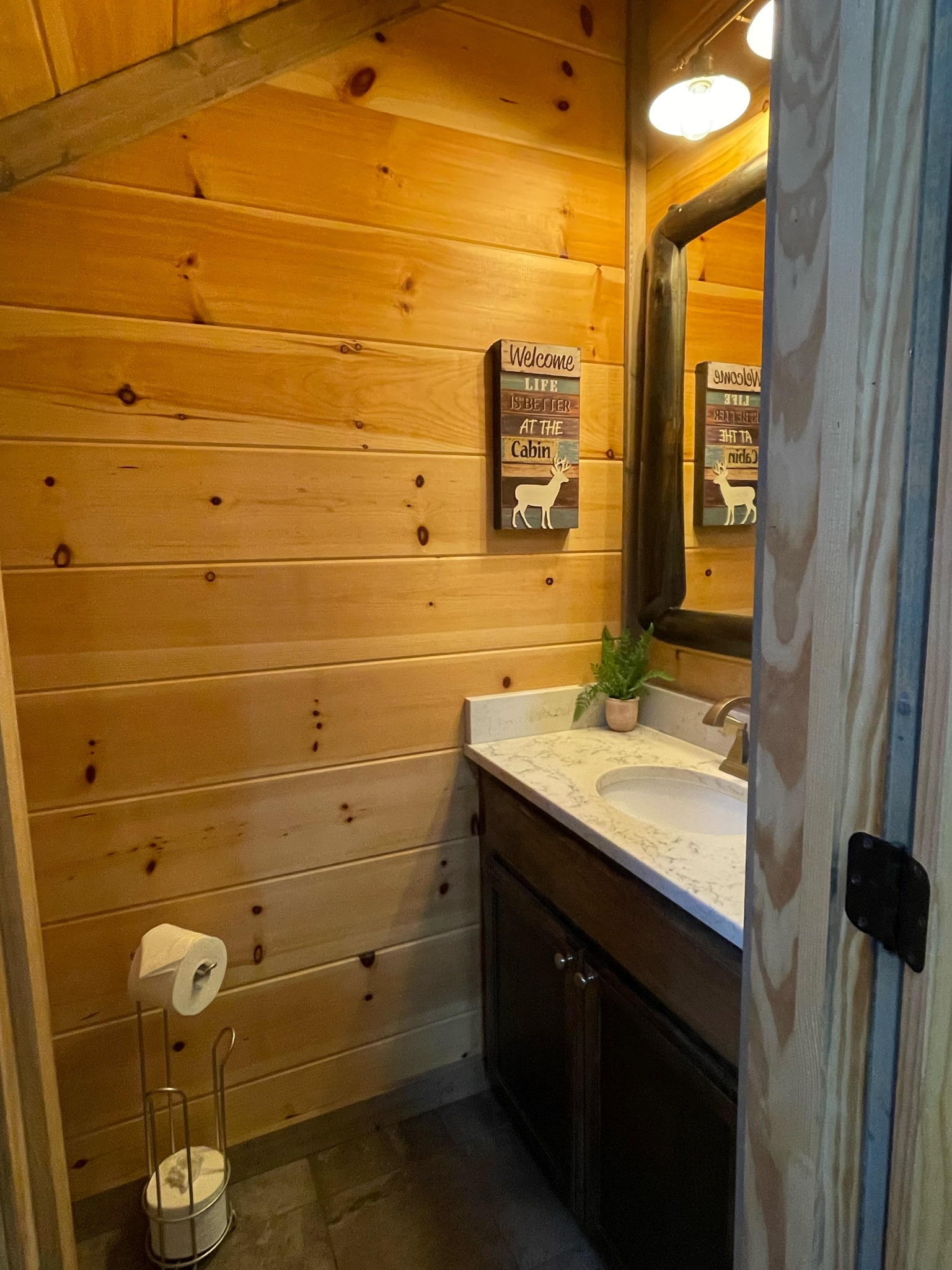 Downstairs 1/2 bath conveniently located for all guests.