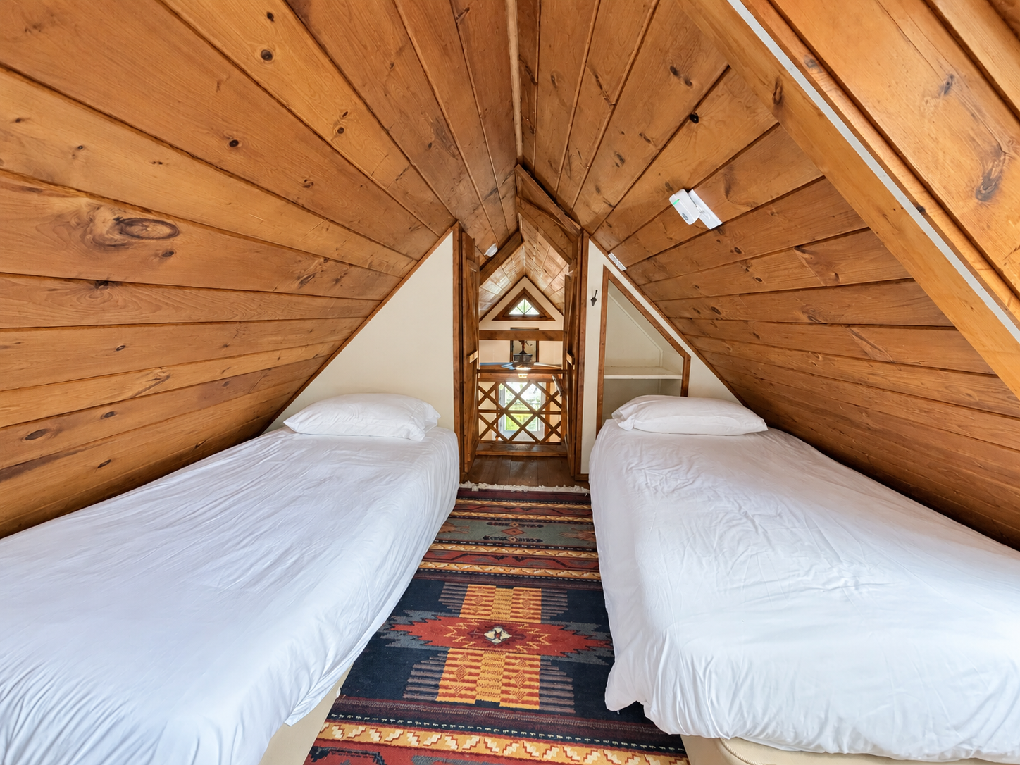 Upstairs sleeping loft with 2 twin beds and big skylight