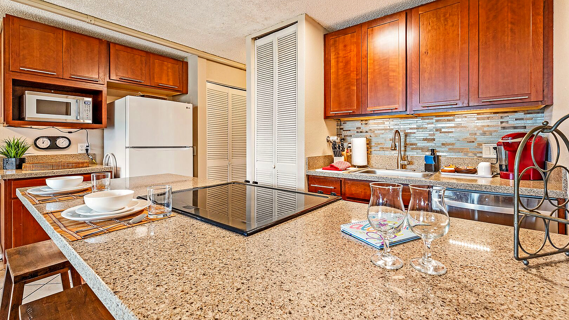 Open concept kitchen with quartz countertops.