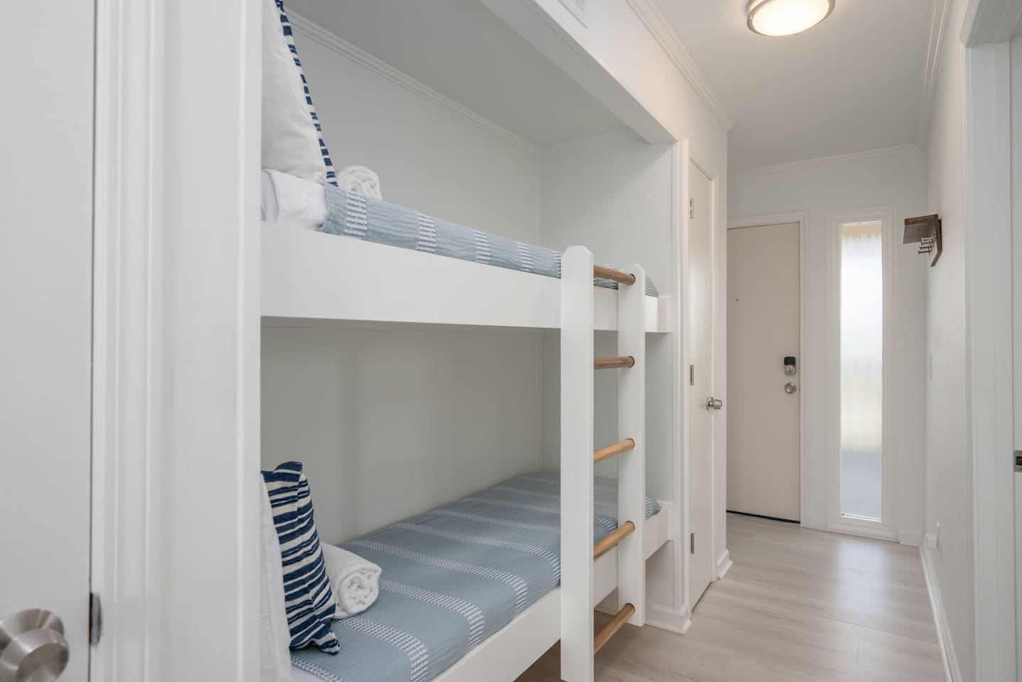 Twin bunk beds located in the entryway.