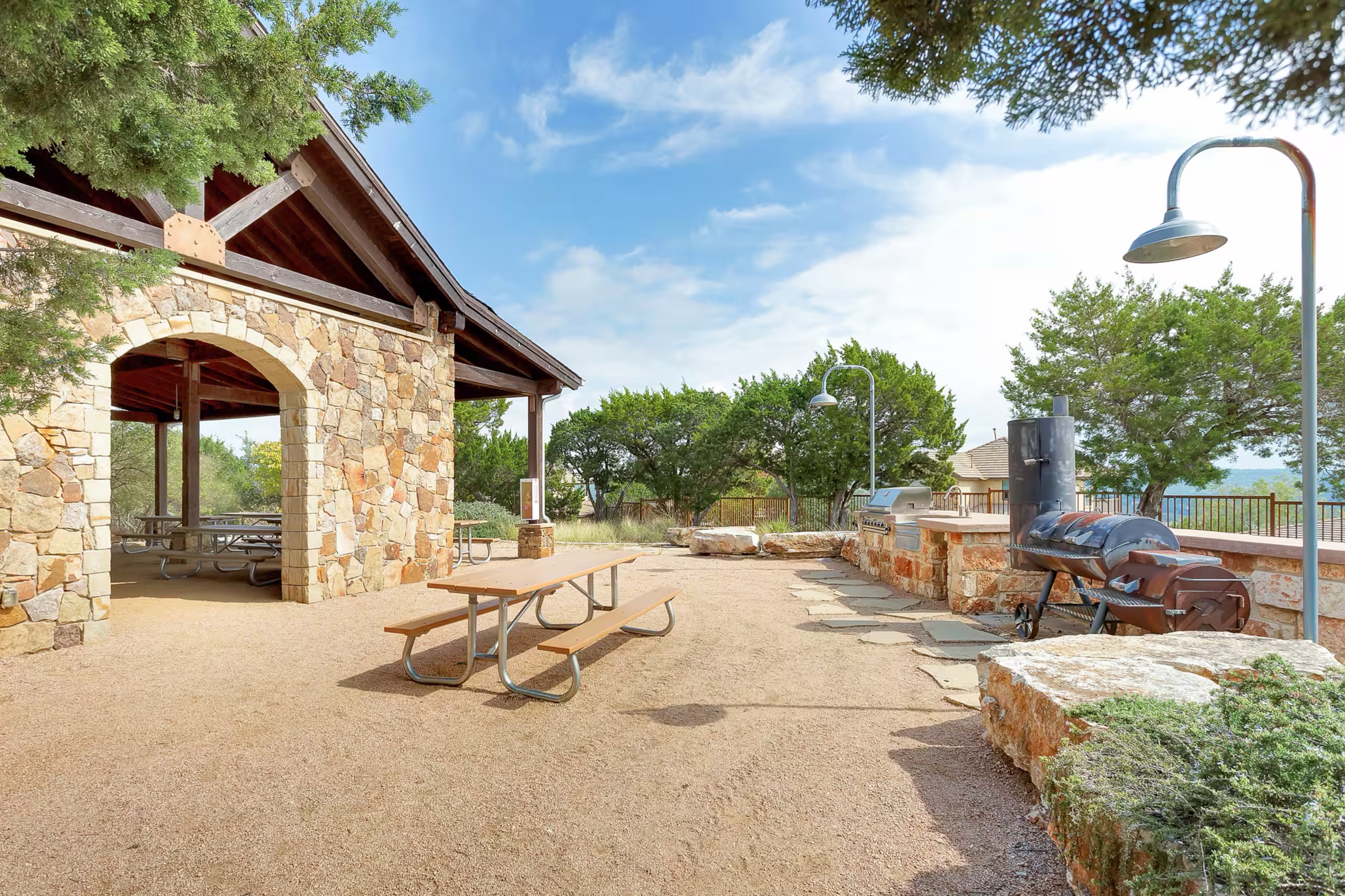 Hilltop Smokehouse offers a dedicated outdoor grilling and gathering area for guests.