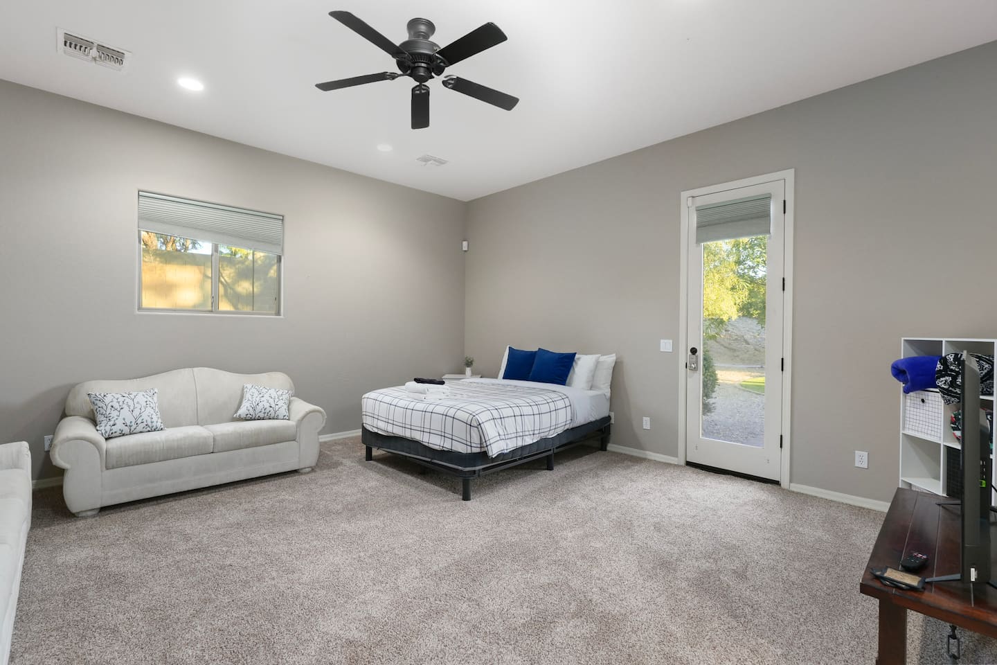 Wide view of the private casita with queen bed, seating area, and separate entrance.