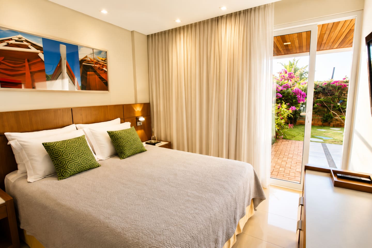 Spacious bedroom 1, with direct access to the private patio.