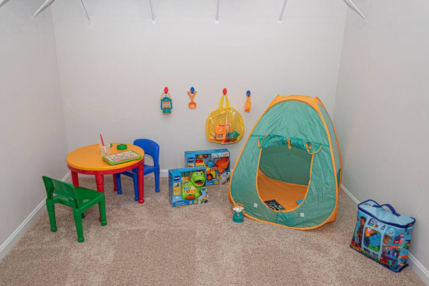 Welcome to the kids' play area tucked within the walk-in closet off the master bedroom! A creative space for little ones to play, imagine, and explore, making use of the closet's cozy nooks and crannies for endless adventures and fun.