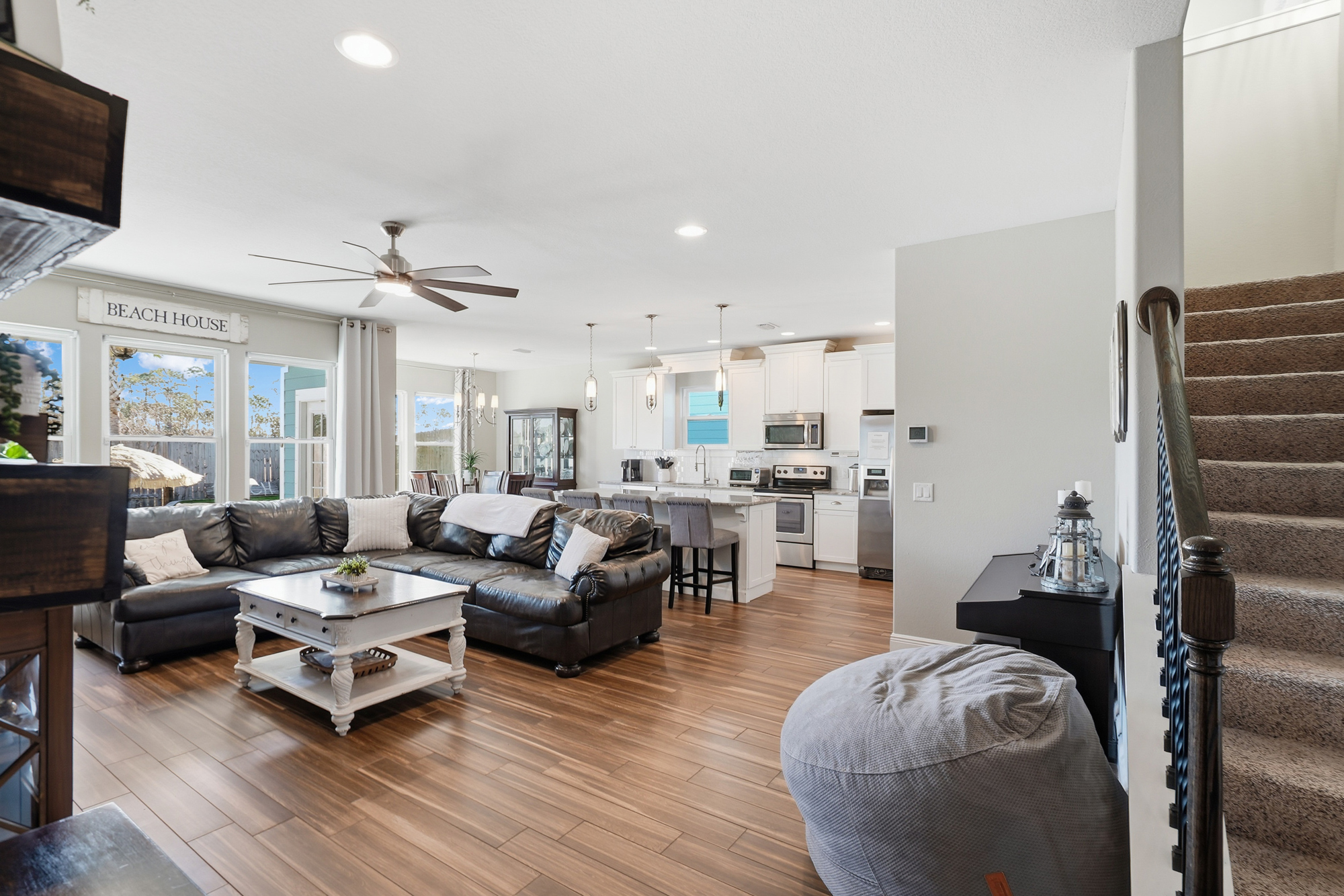 Comfortable coastal living room with plenty of seating for guests to gather and unwind.