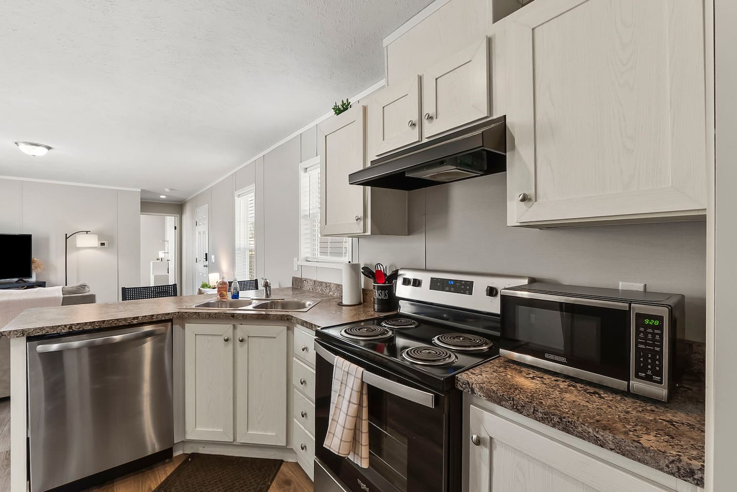 Fully equipped kitchen with modern appliances, ample counter space, and everything you need for a comfortable stay.