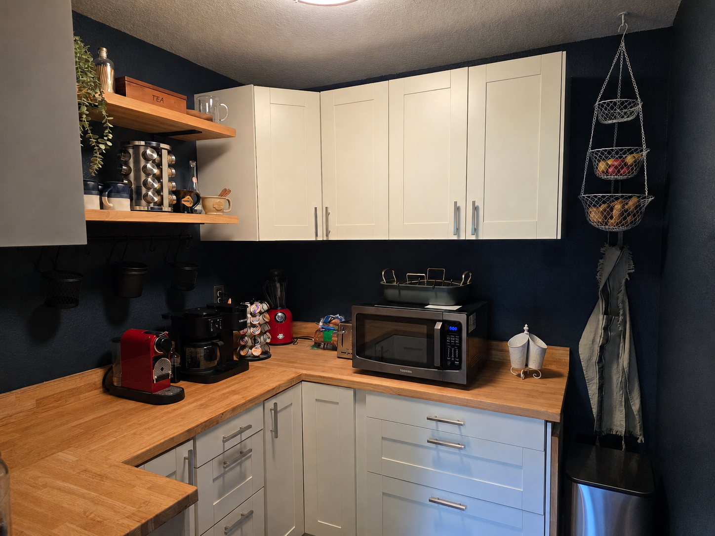 Well-stocked pantry and coffee bar with extra storage, small appliances and grab-and-go convenience.