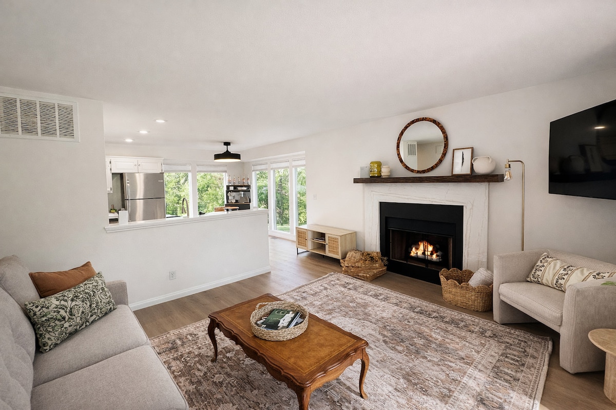 A warm living room centered around the fireplace — perfect for cool Bentonville evenings.