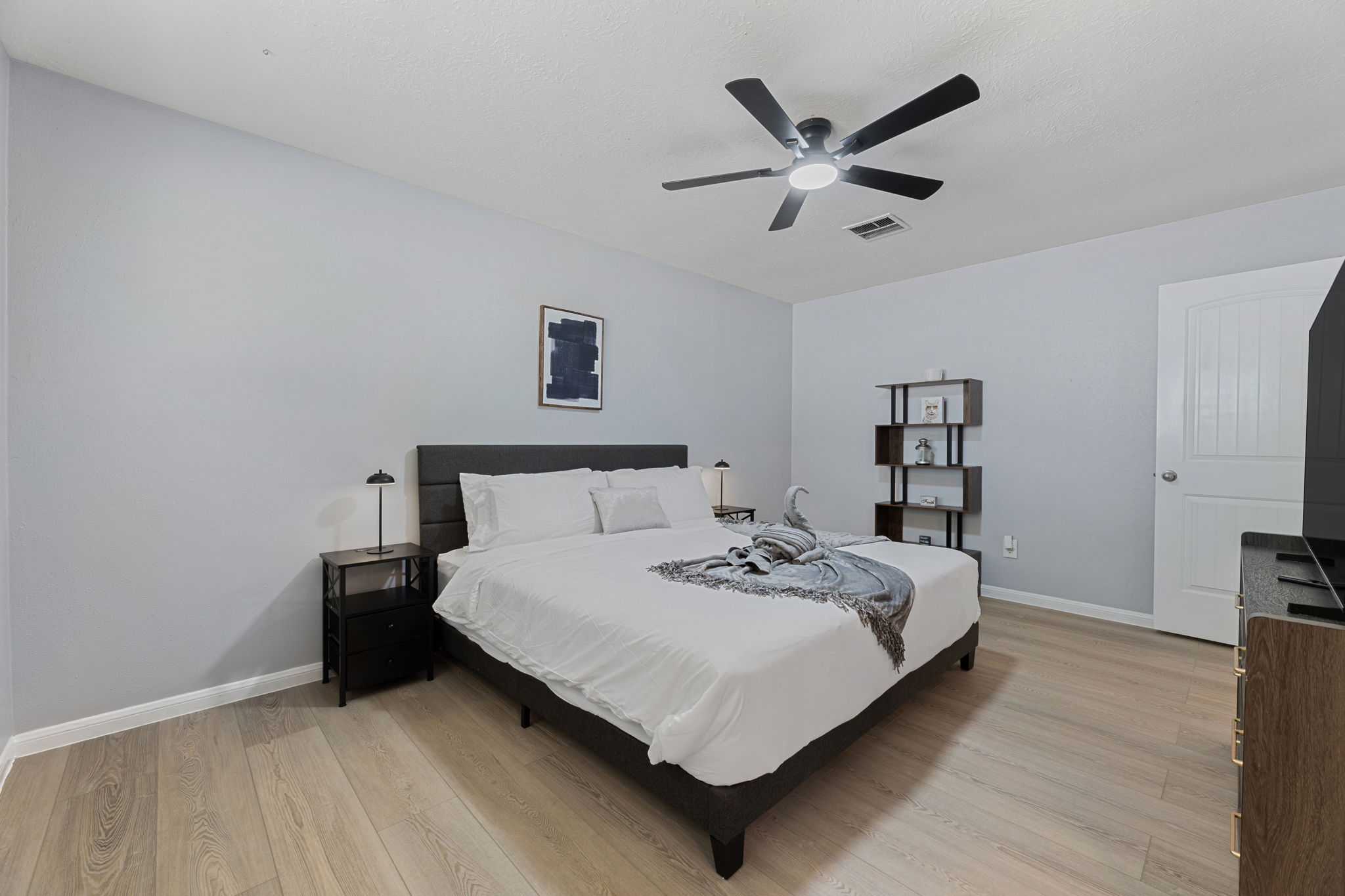 Retreat to the luxurious master suite with a king bed, private bath, and TV for ultimate comfort and privacy.