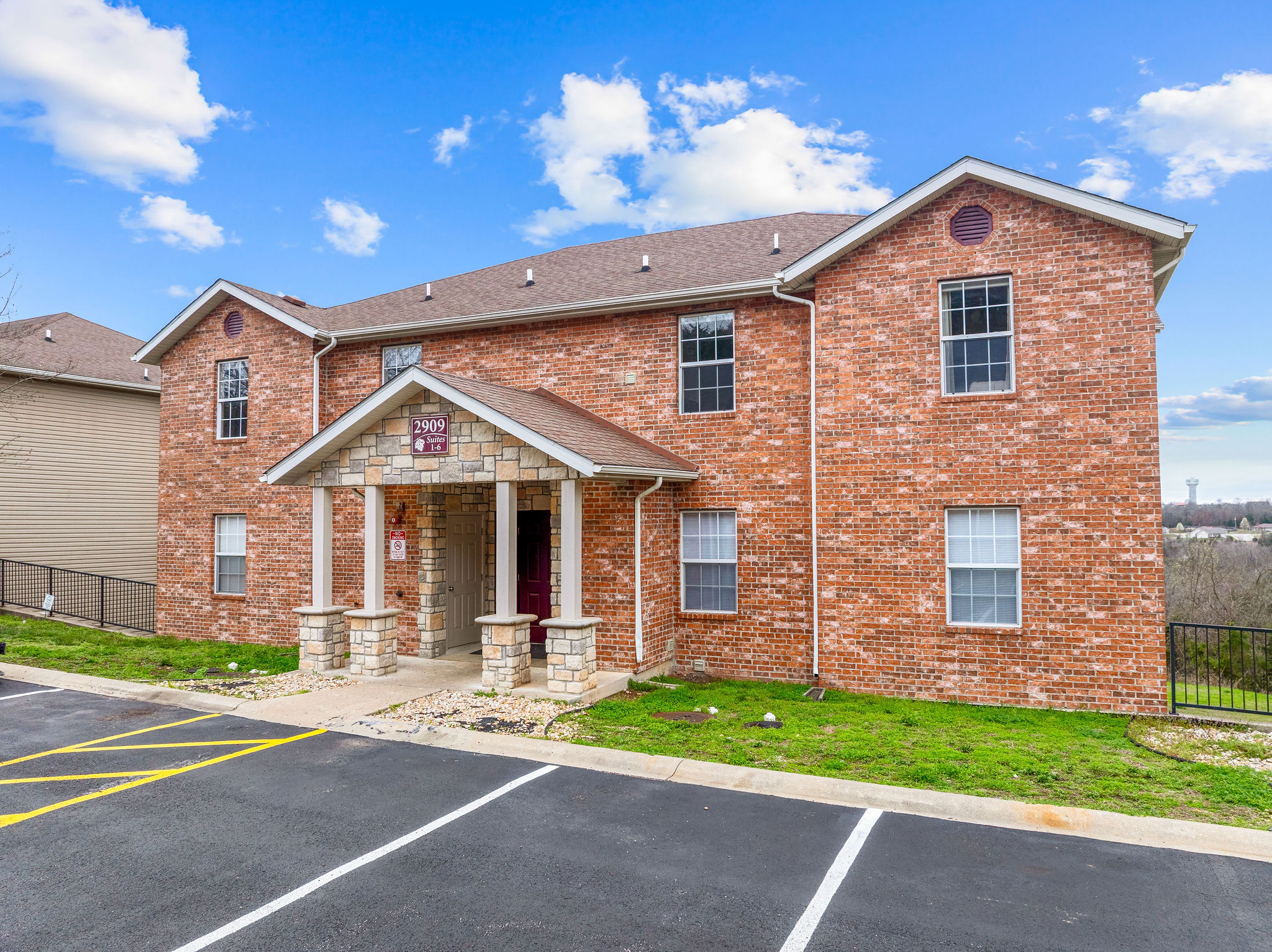 Front exterior of the building with parking