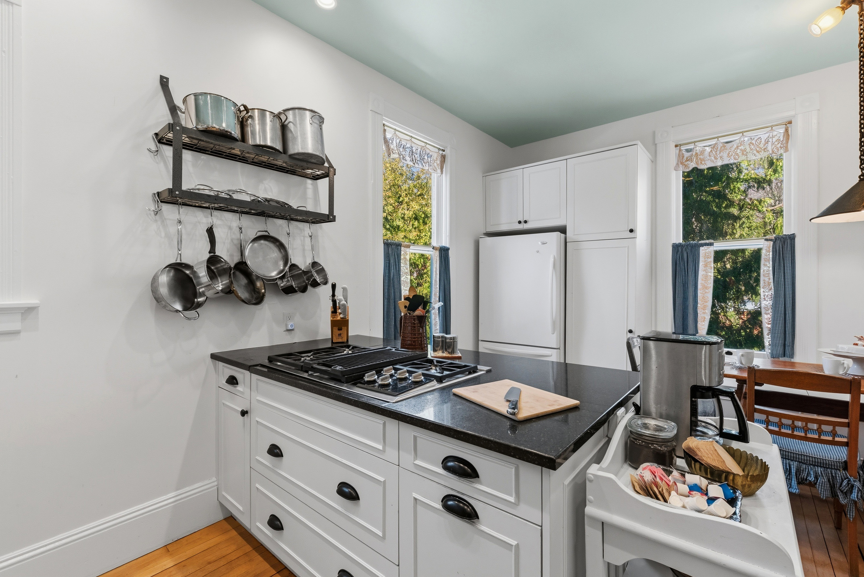 Farmhouse kitchen w/ open shelving & rustic accents