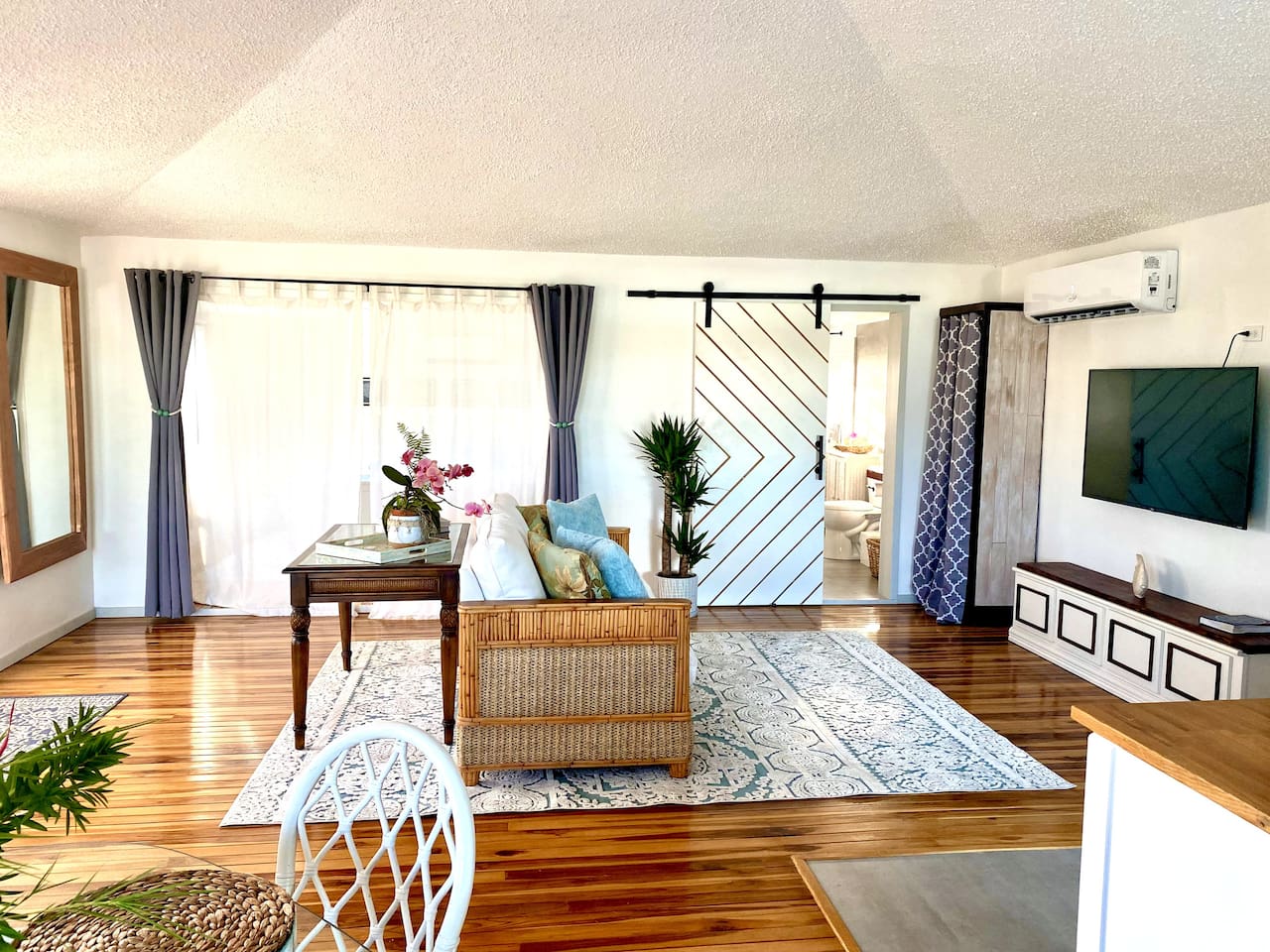 This is the main room of the 2nd level we call the Coral Suite. We lived here when we reno'd the lower level. Very spacious, pull out couch, table to work. Our favorite part is the teak flooring. We are slightly obsessed with teak and hardwoods;)
