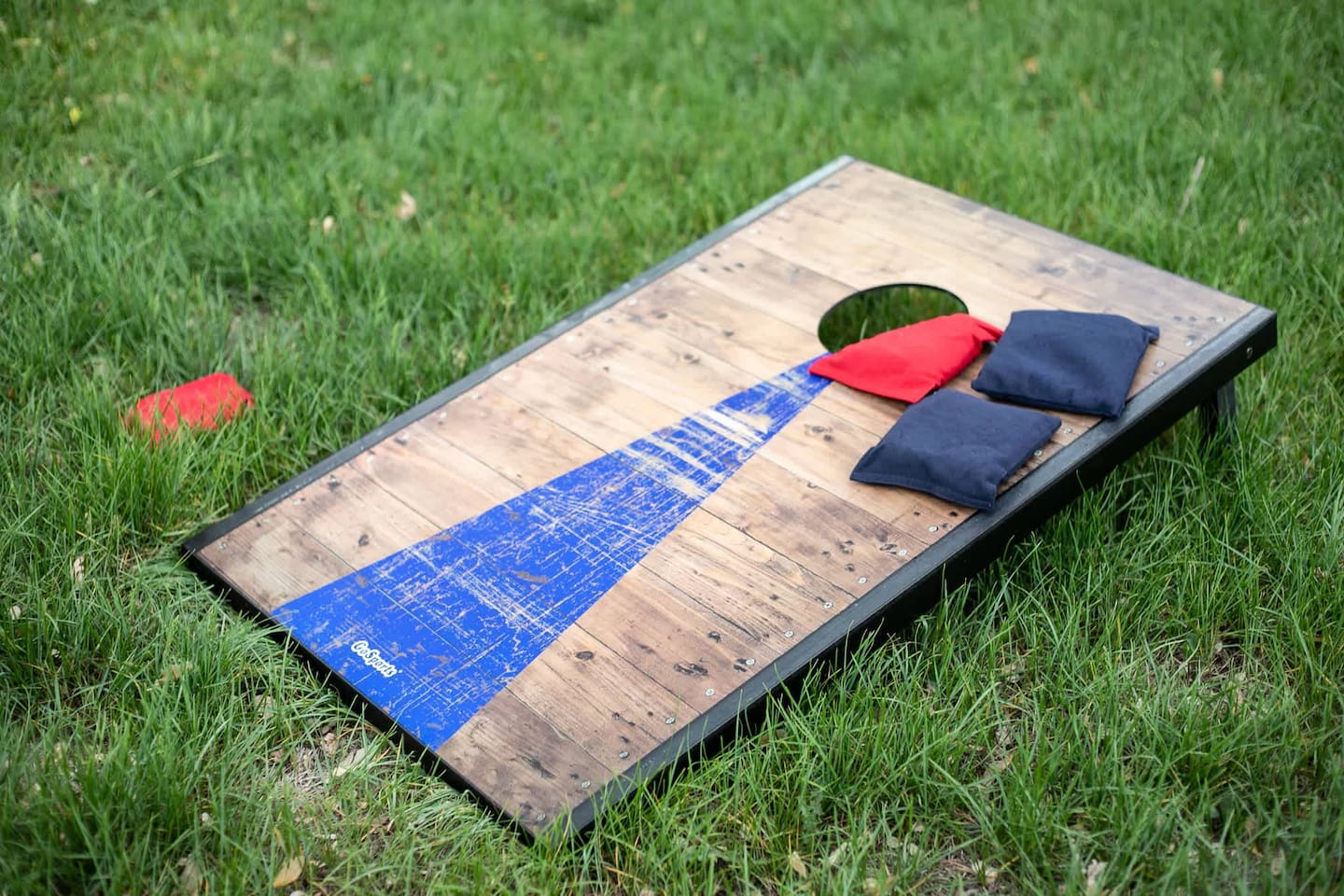 Play a game of cornhole in the backyard while grilling something delicious!