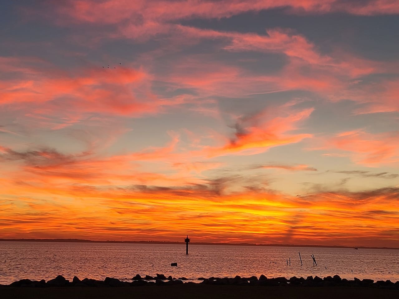 Amazing colors at sunset from Corolla Park across the street. 