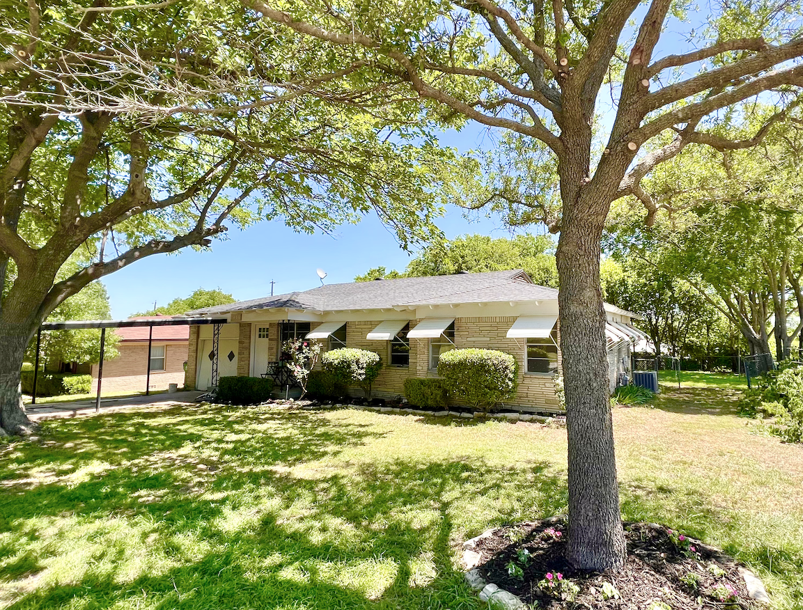 Two beautiful trees give tons of shade out front