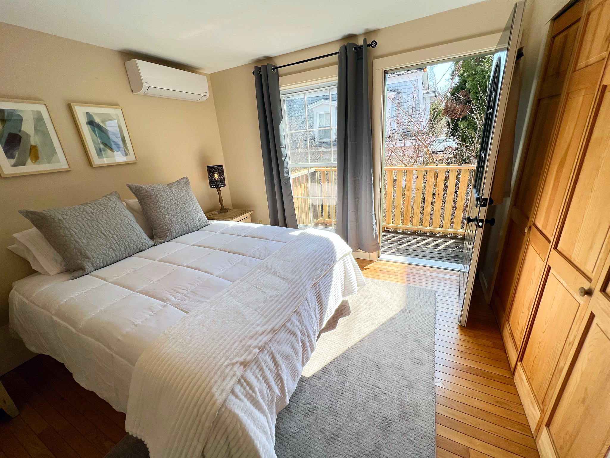 The primary bedroom features a plush queen memory foam mattress for a premium sleep experience. Balcony!