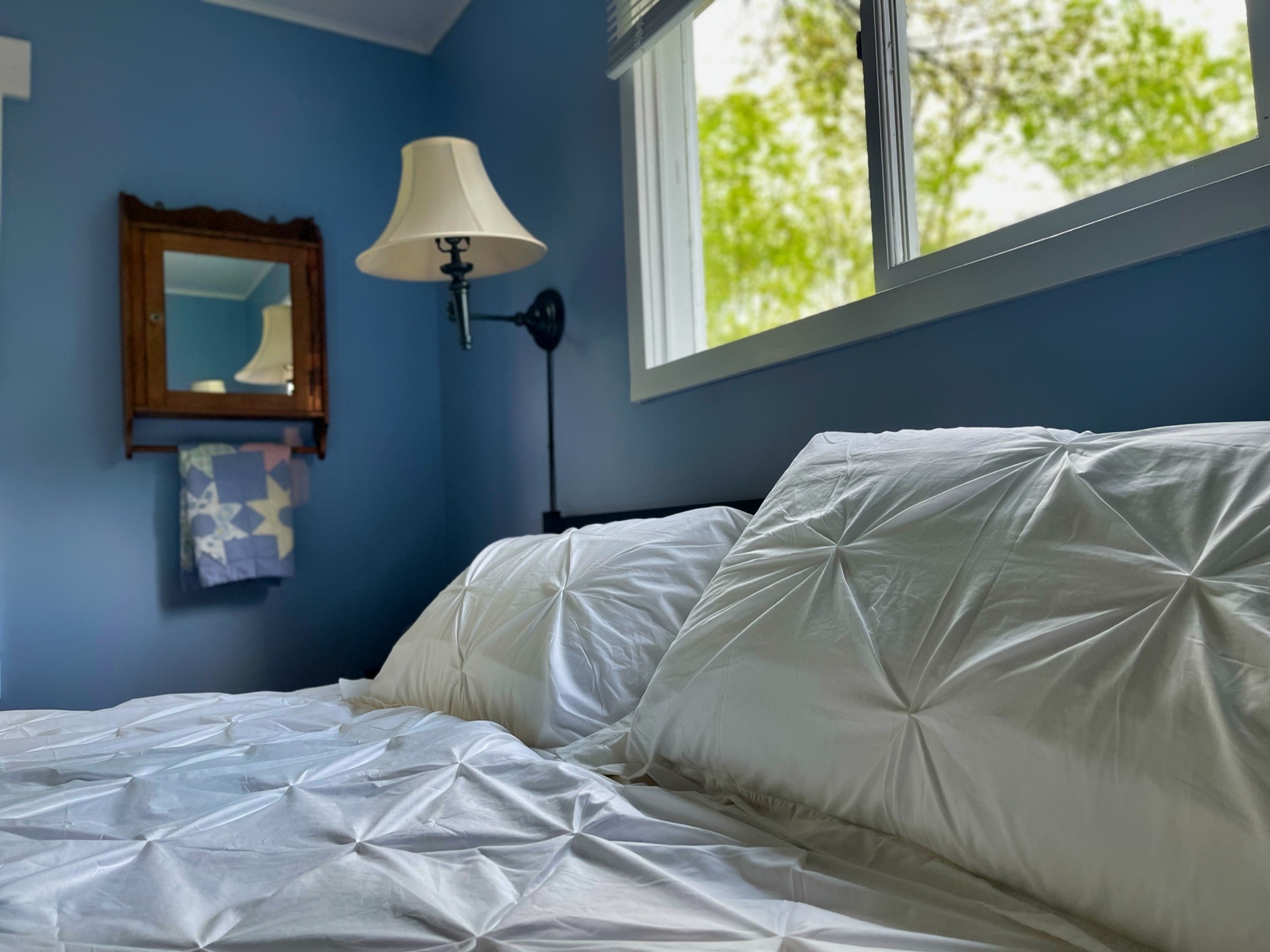 Big Pines king bedroom with comfy bedding and bedside reading lamps.
