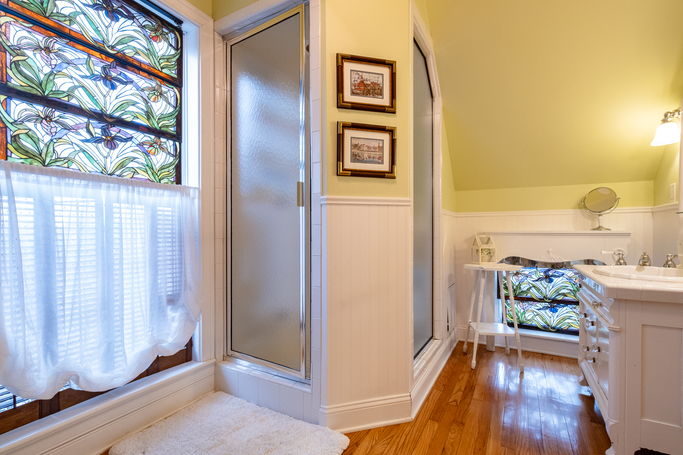 Private bathroom shower area adjacent to the soaking tub, completing the spa experience.