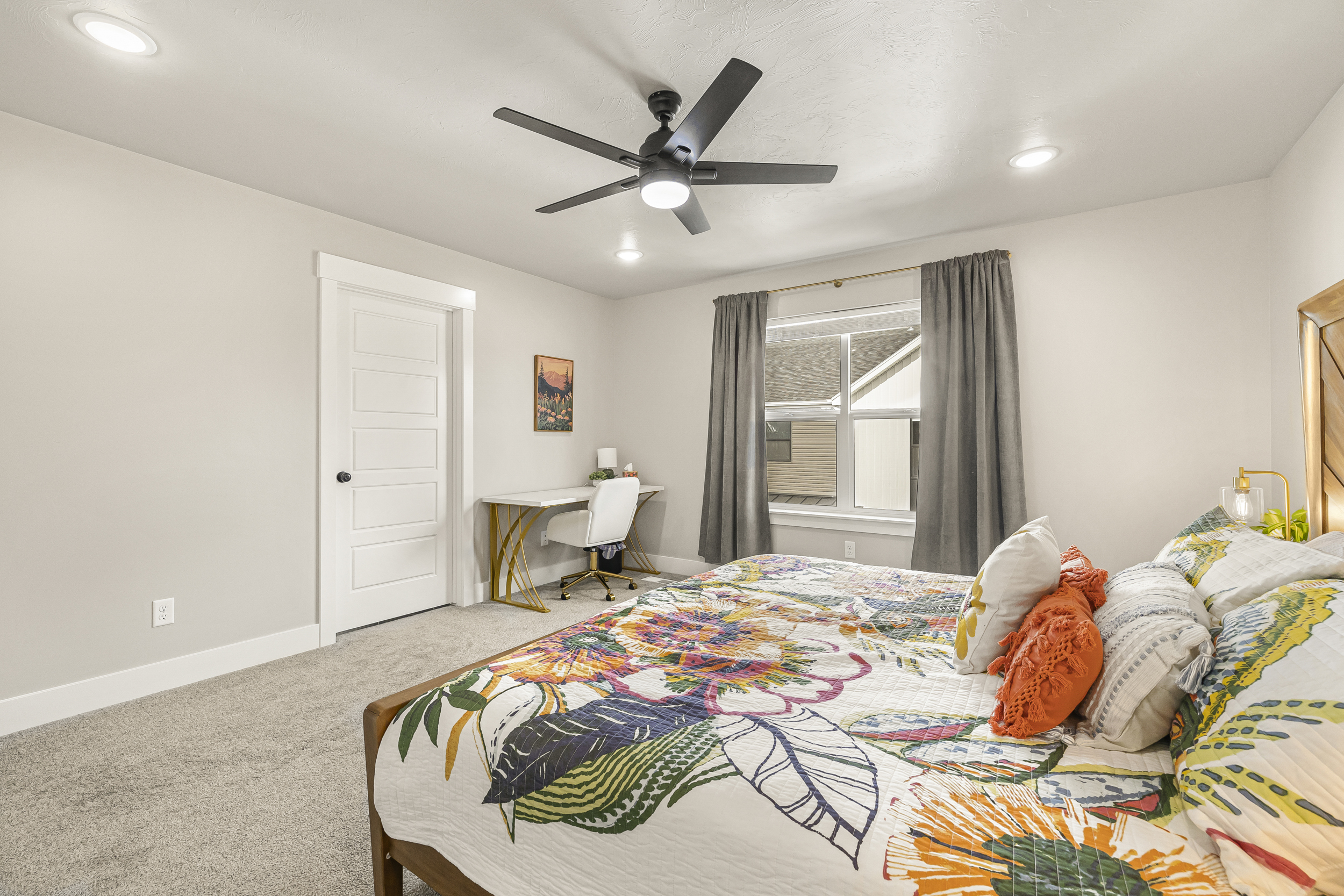 Master bedroom with a workspace area.