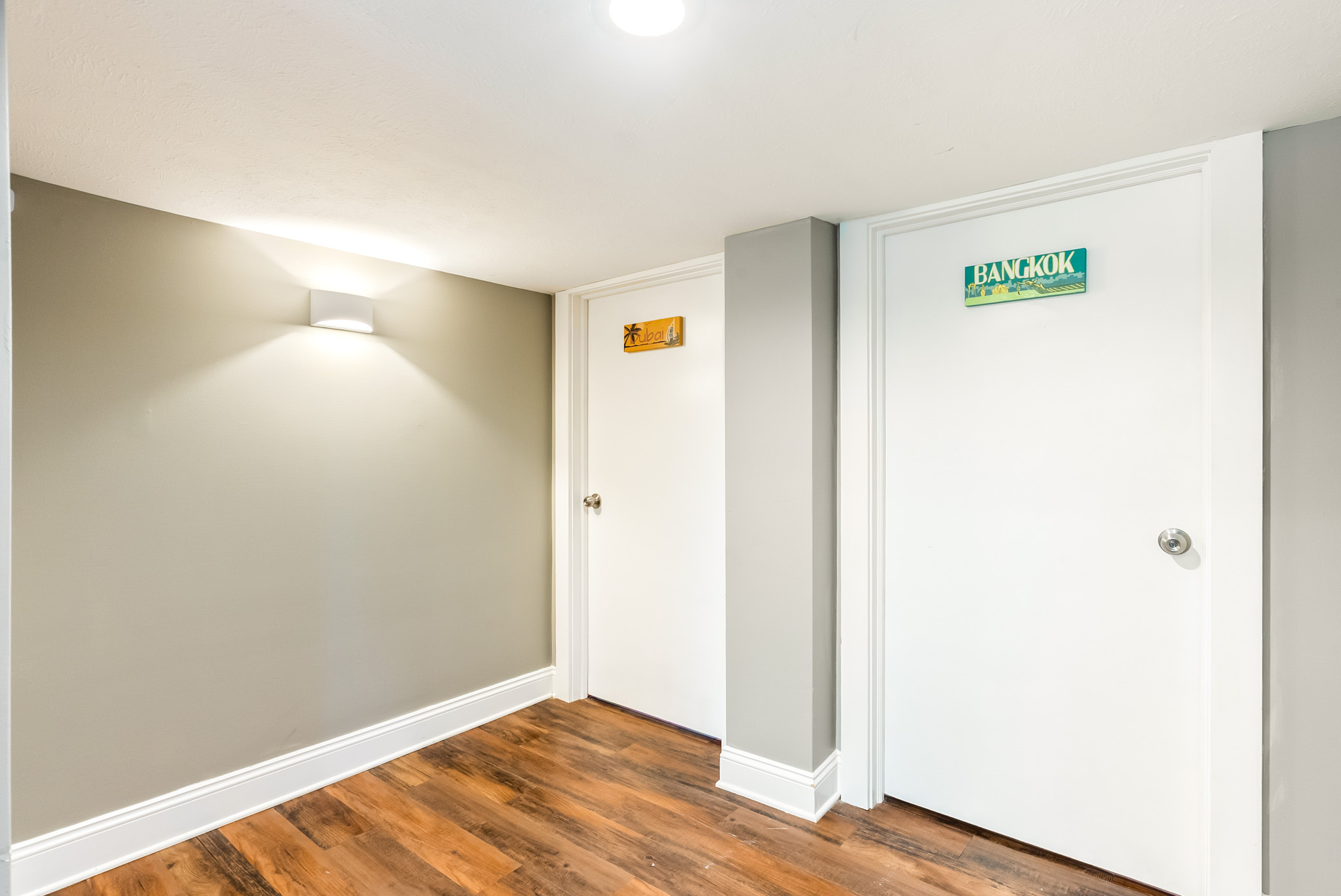Visualizing the flow. A clean, well-lit central hallway cleanly connects the suite's private bedrooms to the Living Room. 