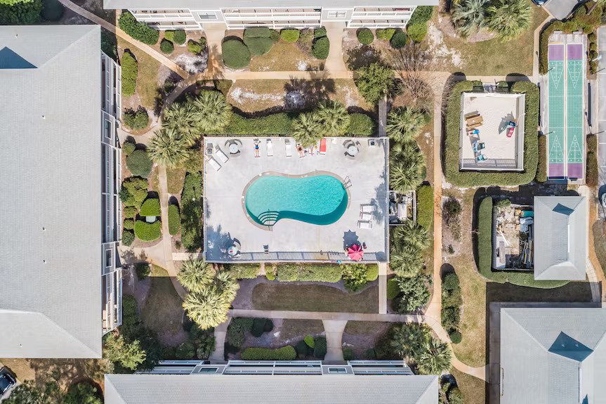 Aerial over the Beachwood Villas pool and courts