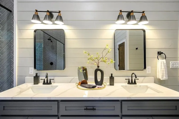 Double vanity setup with sleek fixtures and ample counter space.