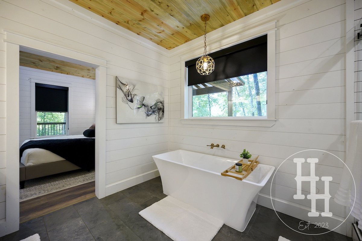 Enjoy our large bath tub with a tray for your favorite book and beverage.