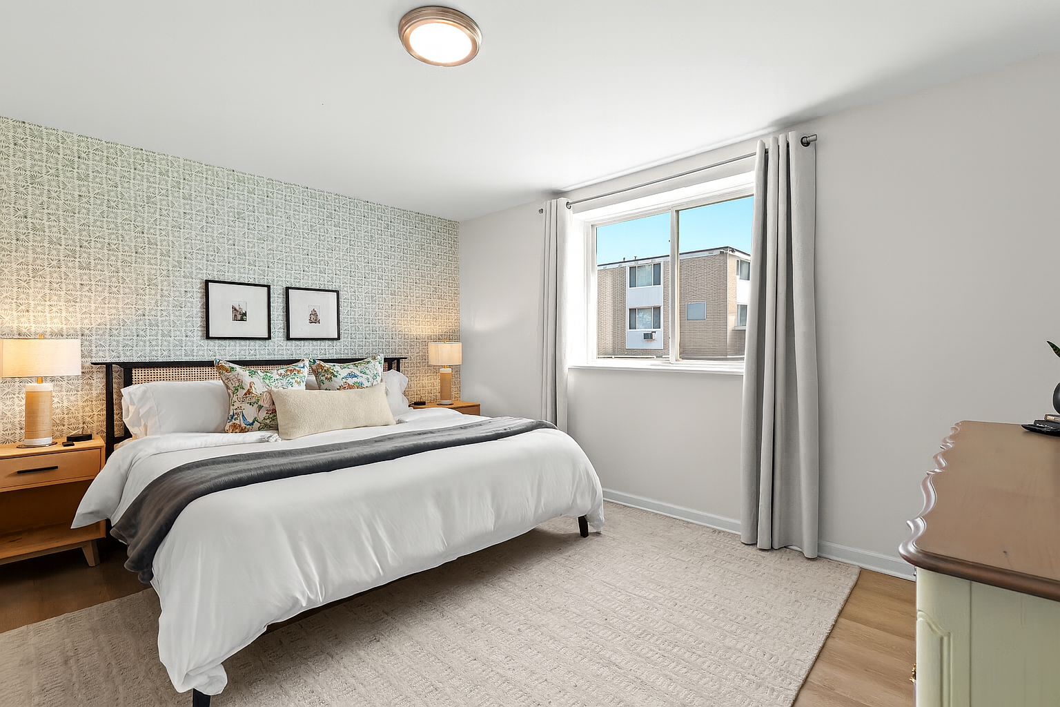 Cozy bedroom with natural light and modern furnishings—your personal haven after a day of exploring.