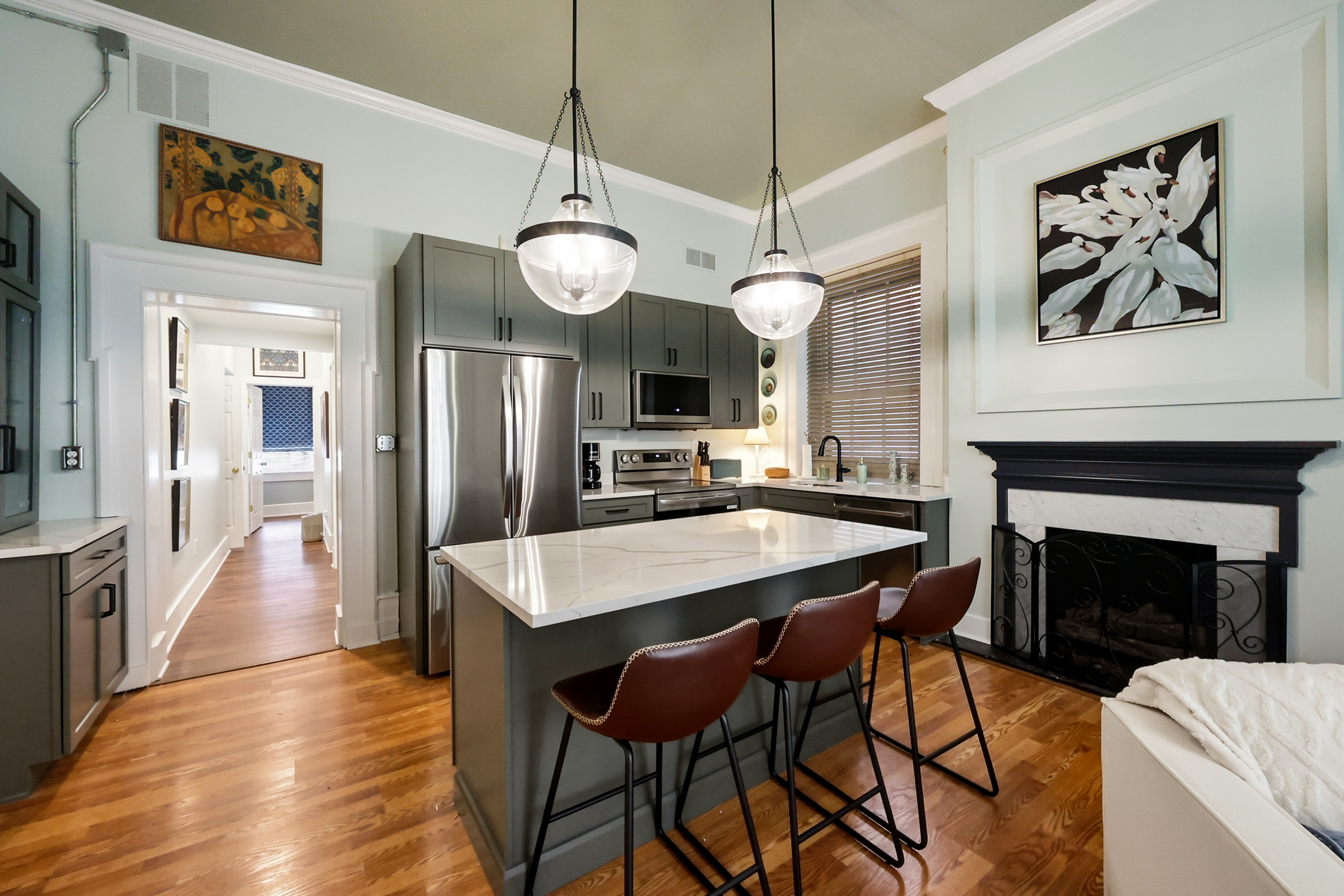 Eat in kitchen with new stainless appliances and large island.(Fireplaces are not operational)