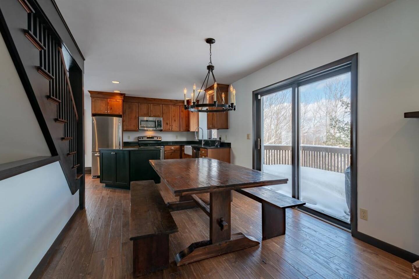 The spacious dining table provides comfortable seating for family dinners and game nights.