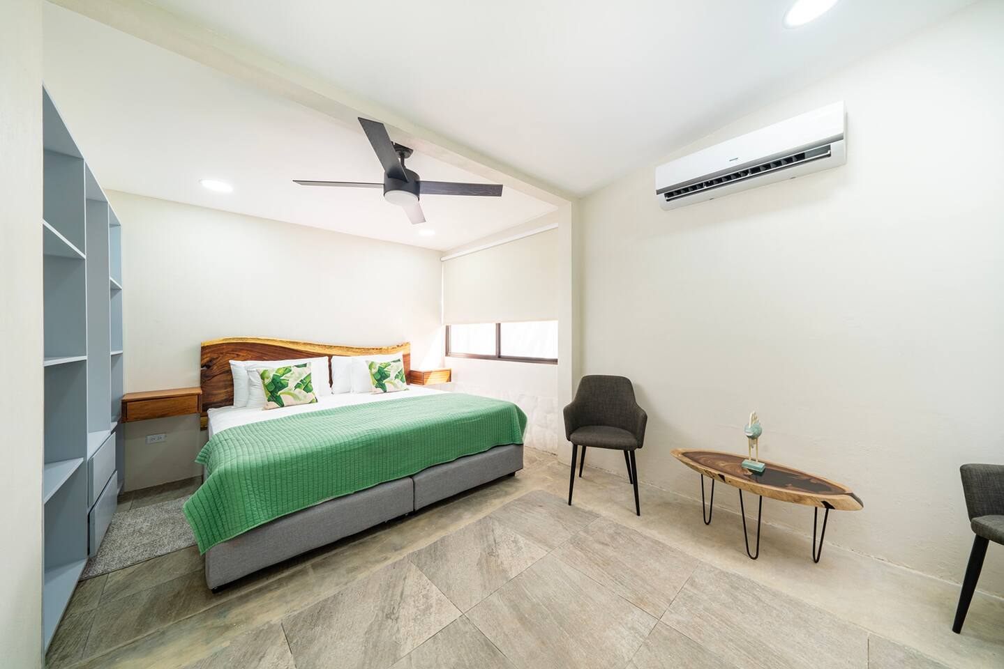 Master bedroom with a king size bed, ensuite bathroom and ample closet space. Choose between air conditioning or ceiling fan for a more natural breeze.
