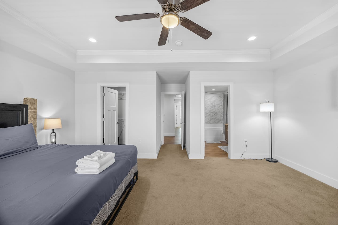 The primary bedroom connects directly to the bathroom and walk-in closet for ease and privacy.
