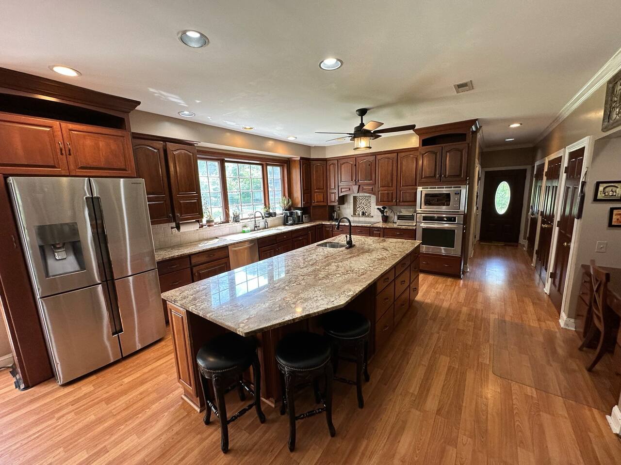 Kitchen with 9 ft ceilings, top quality appliances, 2 sinks, large island, lots of lighting and cabinet space