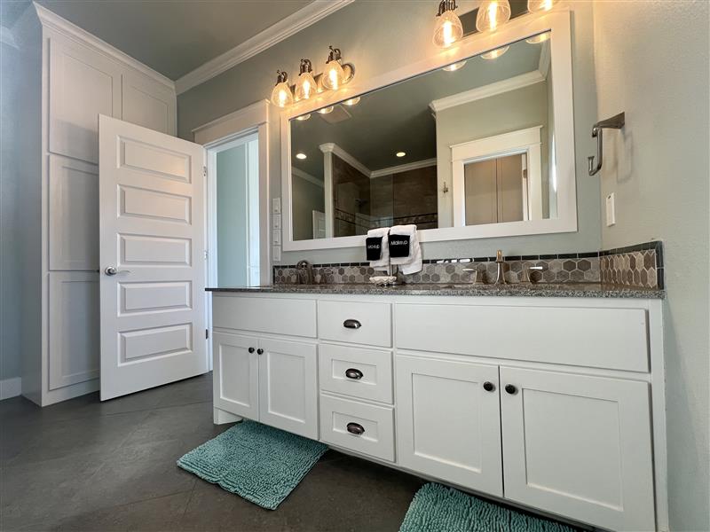 Crystal Paradise Bathroom 4: Stylish vanities with spacious countertops and well-lit mirrors make freshening up a breeze.